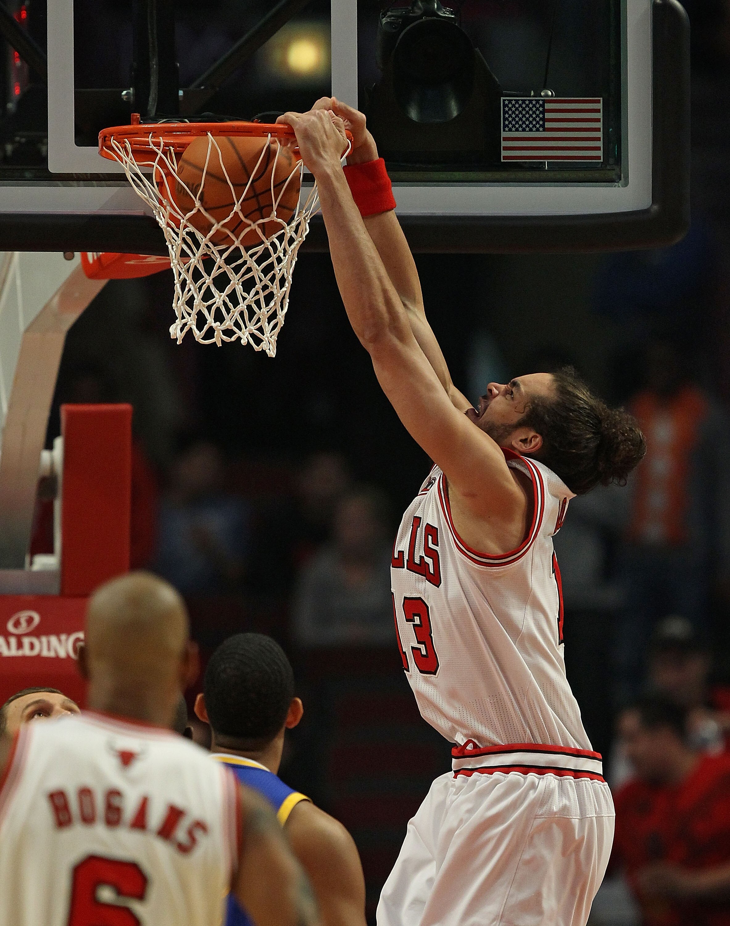CHICAGO - NOVEMBER 11: Joakim Noah #13 of the Chicago Bulls dunks the ball against the Golden State Warriors at the United Center on November 11, 2010 in Chicago, Illinois. NOTE TO USER: User expressly acknowledges and agrees that, by downloading and/or u