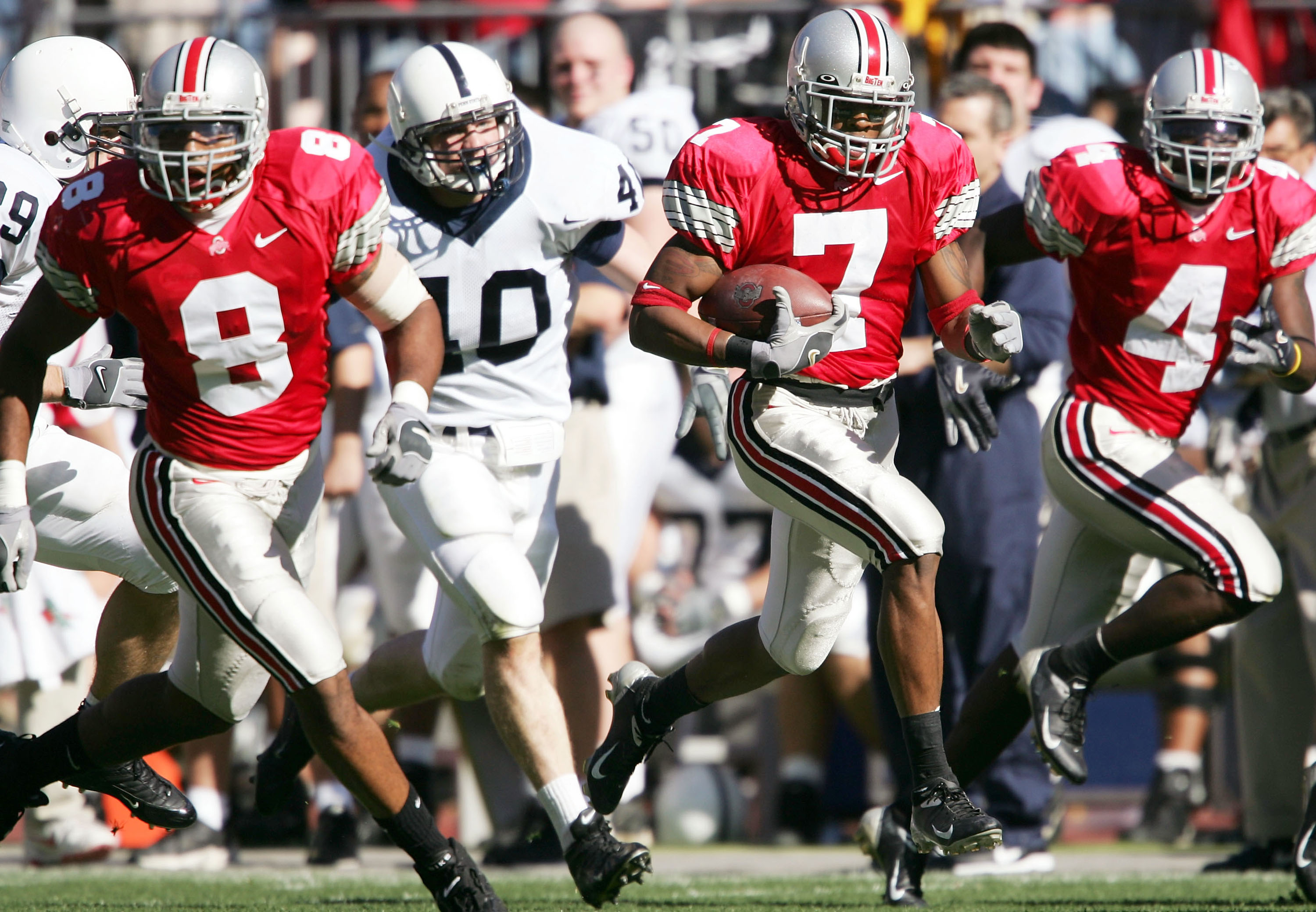 COLUMBUS,OH - OCTOBER 30: Ted Ginn Jr. #7of Ohio State runs with the ball against Penn State at Ohio Stadium on October 30, 2004 in Columbus, Ohio. Ohio State won 21-10.   (Photo by Andy Lyons/Getty Images)