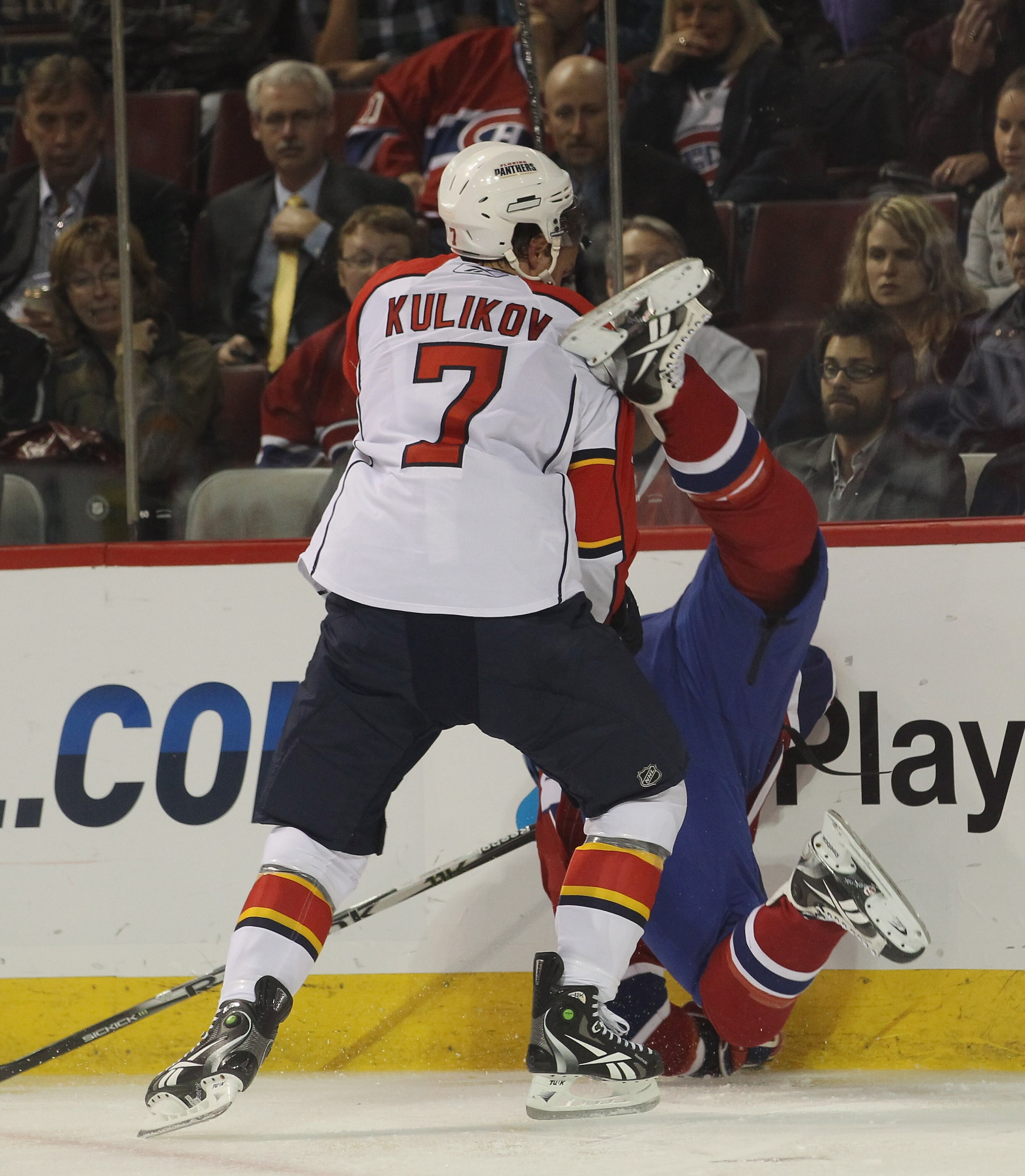 MONTREAL, QC - SEPTEMBER 27:  Dimitri Kulikov #7  of the Florida Panthers hits Gabriel Dumont #37 of the Montreal Canadiens at the Bell Centre on September 27, 2010 in Montreal, Canada.  (Photo by Bruce Bennett/Getty Images)