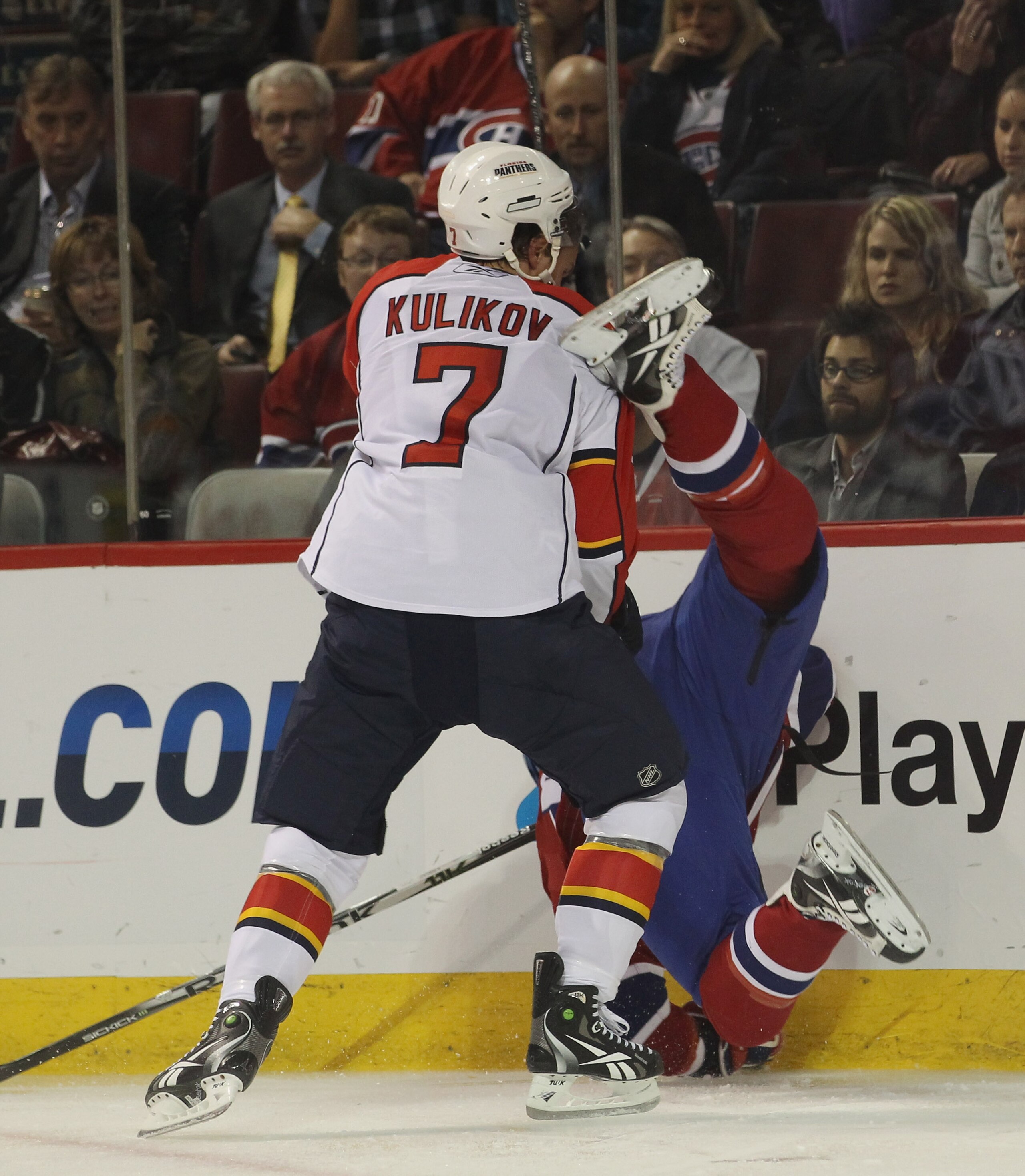 MONTREAL, QC - SEPTEMBER 27:  Dimitri Kulikov #7  of the Florida Panthers hits Gabriel Dumont #37 of the Montreal Canadiens at the Bell Centre on September 27, 2010 in Montreal, Canada.  (Photo by Bruce Bennett/Getty Images)