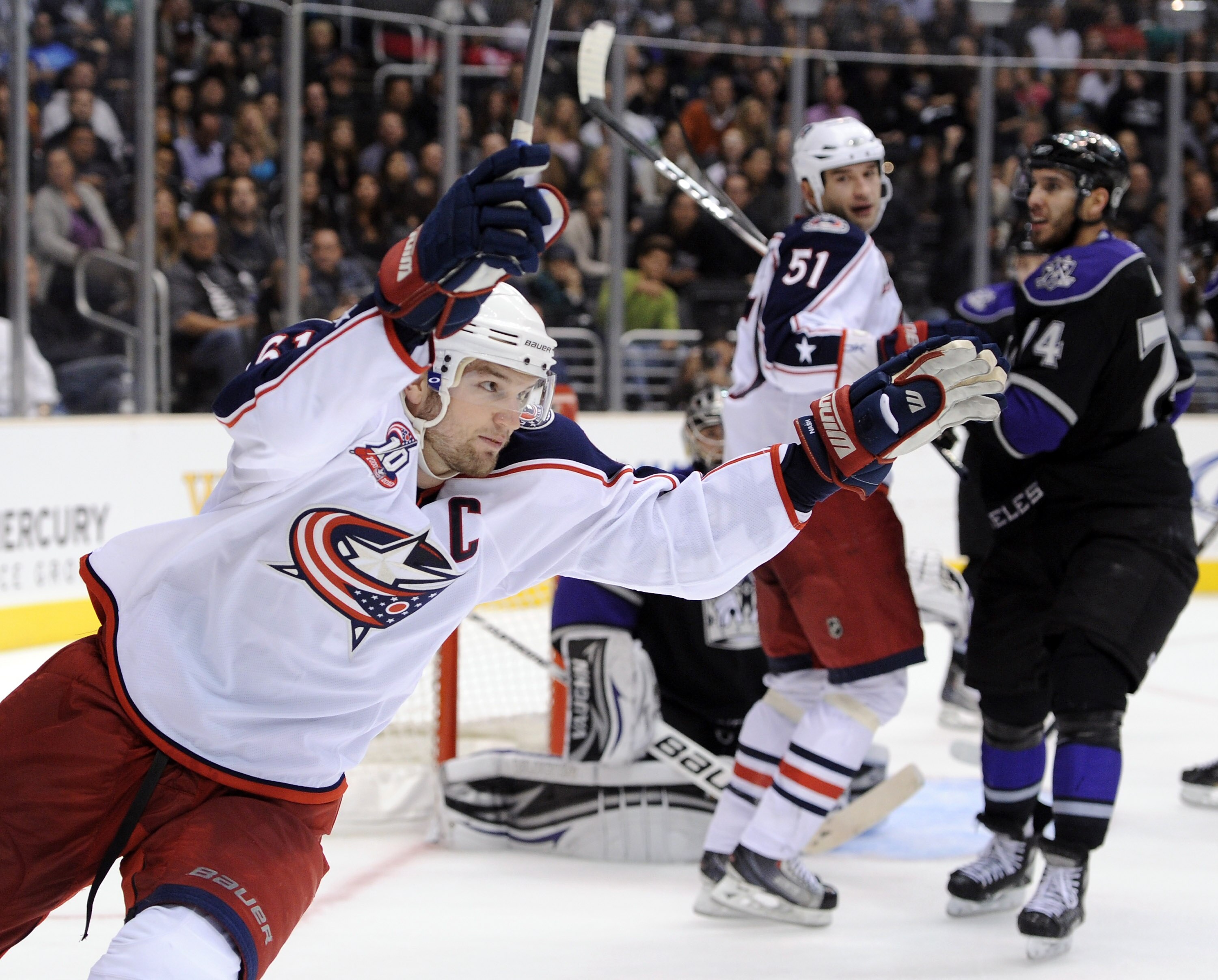 LOS ANGELES, CA - NOVEMBER 17:  Rick Nash #61 of the Columbus Blue Jackets celebrates his goal in front of teammate Fedor Tyutin #51 and a dejected Dwight King #74 and Jonathan Quick #32 of the Los Angeles Kings during the third period at the Staples Cent
