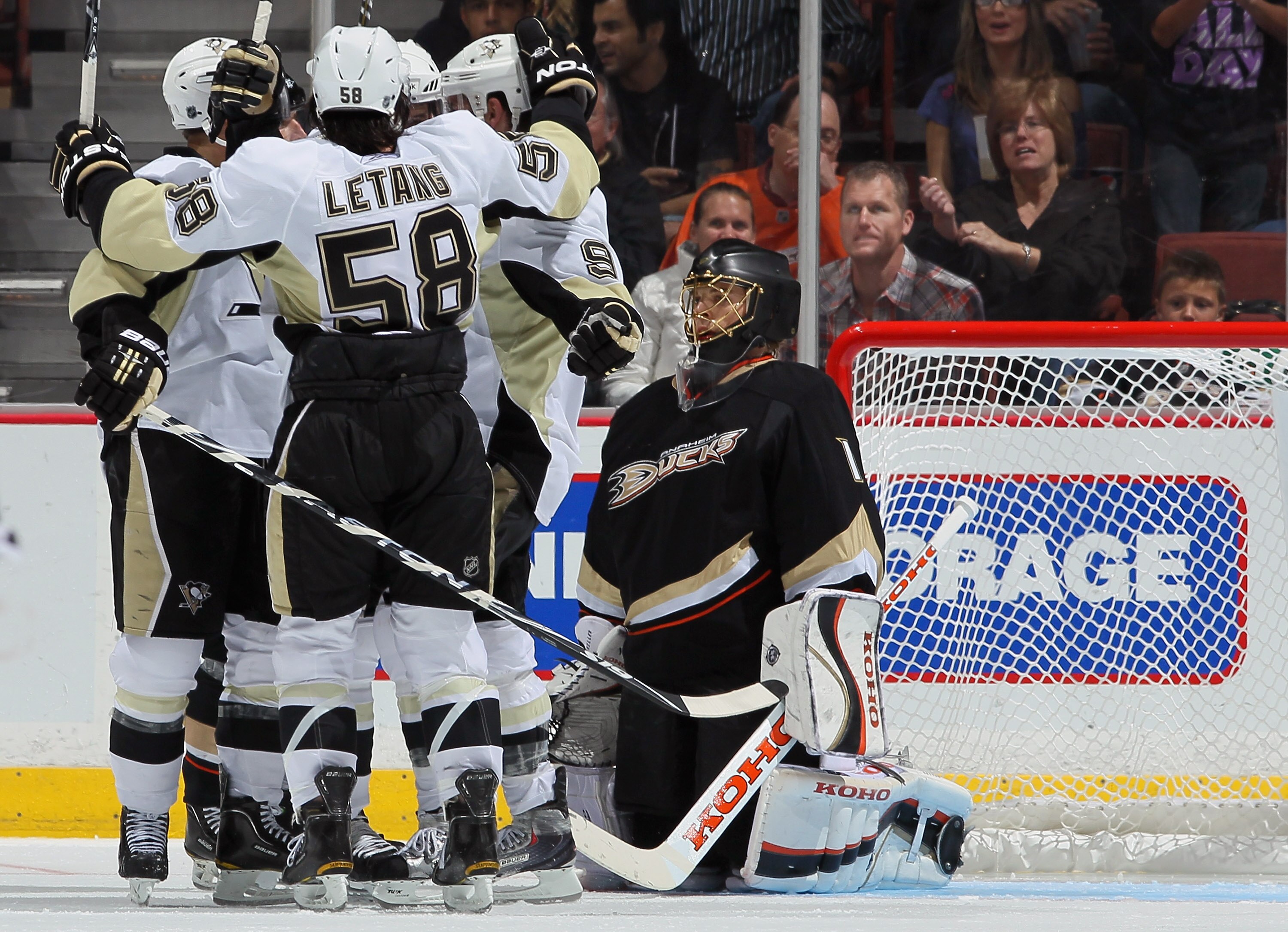 ANAHEIM, CA - NOVEMBER 05:  Kris Letang #58 of the Pittsburgh Penguins celebrates a goal with his teammates as goaltender Jonas Hiller #1 of the Anaheim Ducks looks on in the third period at the Honda Center on November 5, 2010 in Anaheim, California. The