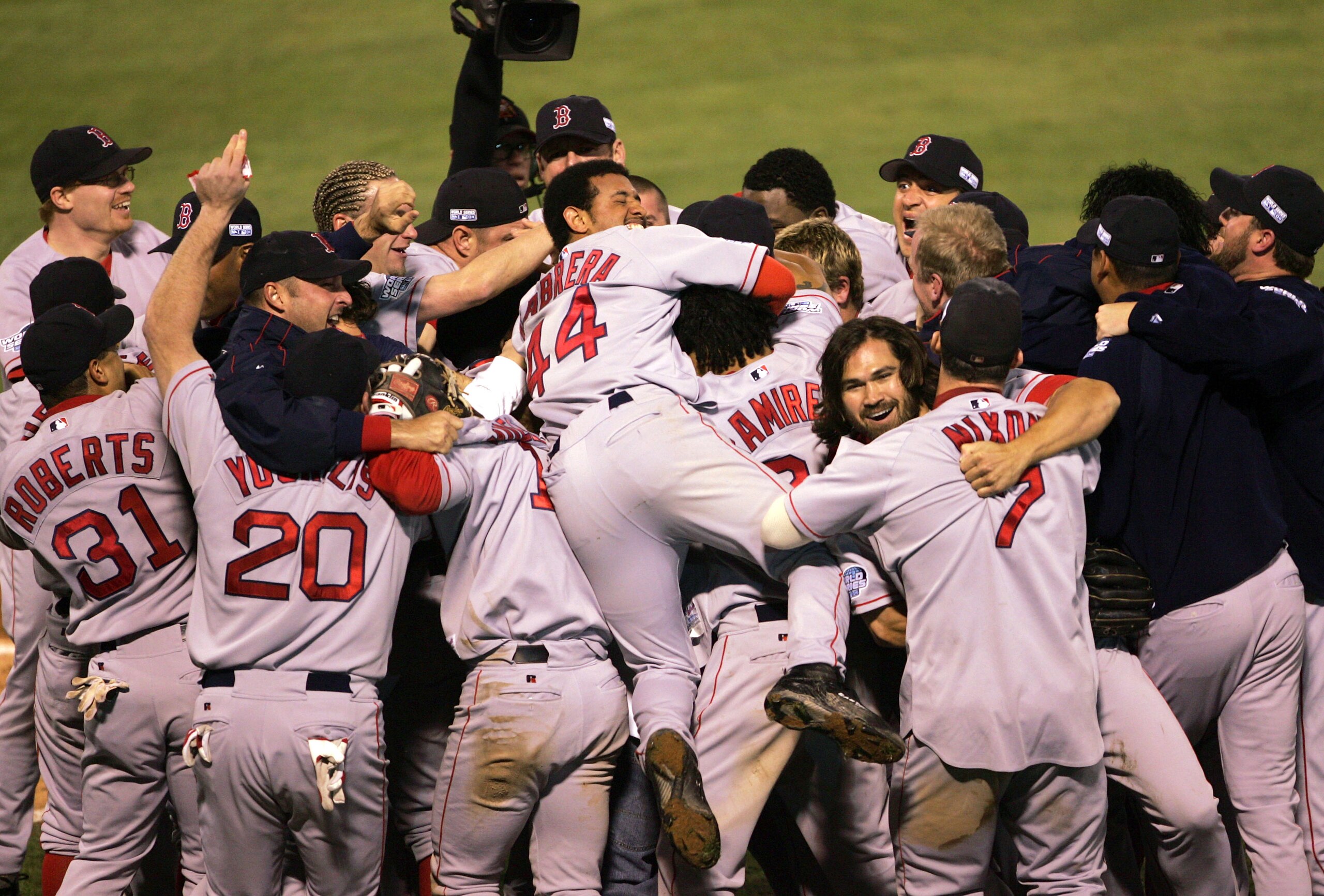 ST LOUIS - OCTOBER 27:  The Boston Red Sox celebrate after defeating the St. Louis Cardinals 3-0 to win game four of the World Series on October 27, 2004 at Busch Stadium in St. Louis, Missouri.  (Photo by Stephen Dunn/Getty Images)