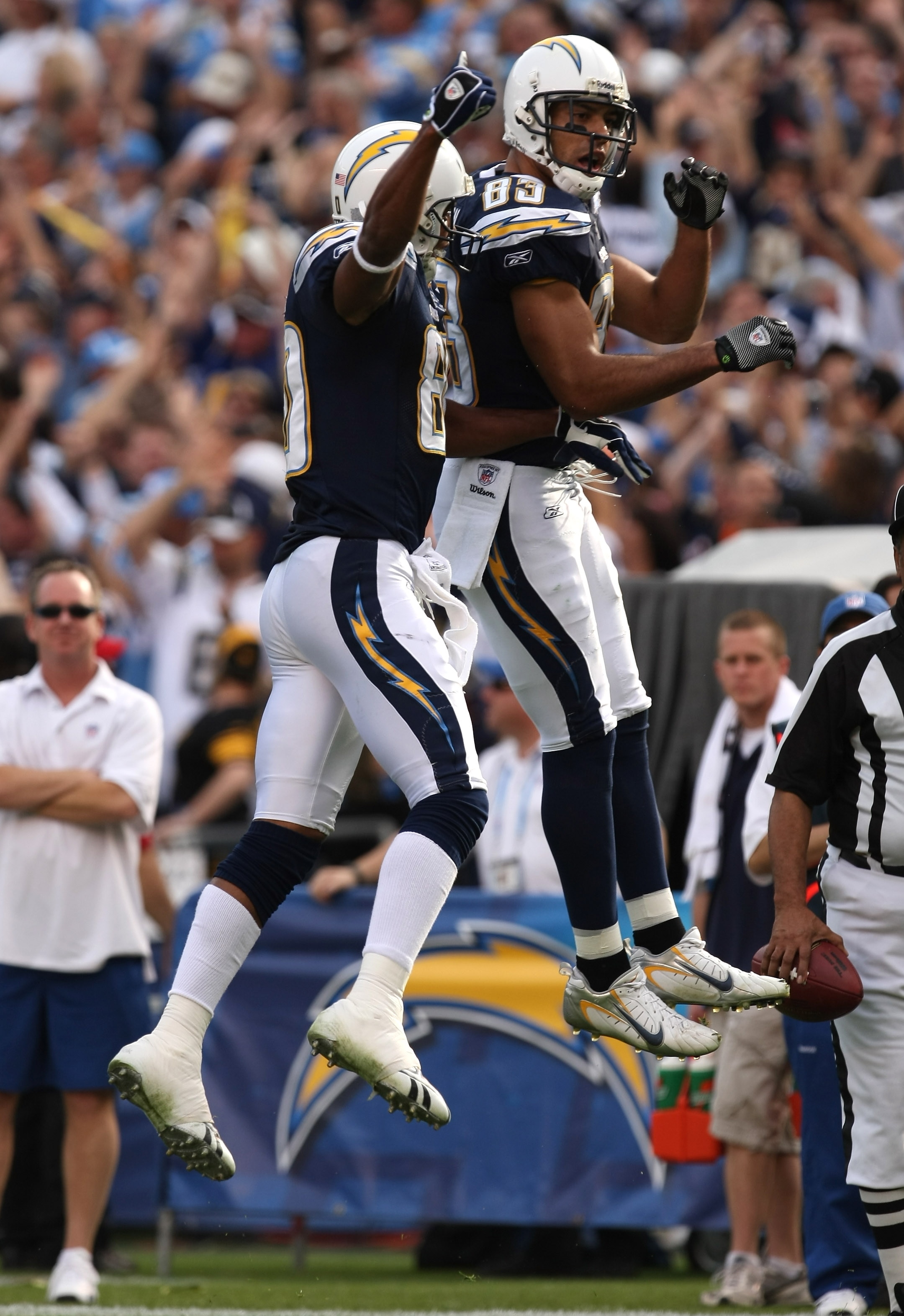 SAN DIEGO - DECEMBER 20:  Wide receivers Vincent Jackson #83 and Malcolm Floyd #80 of the San Diego Chargers jump to celebrate Jackson's second quarter touchdown catch against  the Cincinnati Bengals on December 20, 2009 at Qualcomm Stadium in San Diego,
