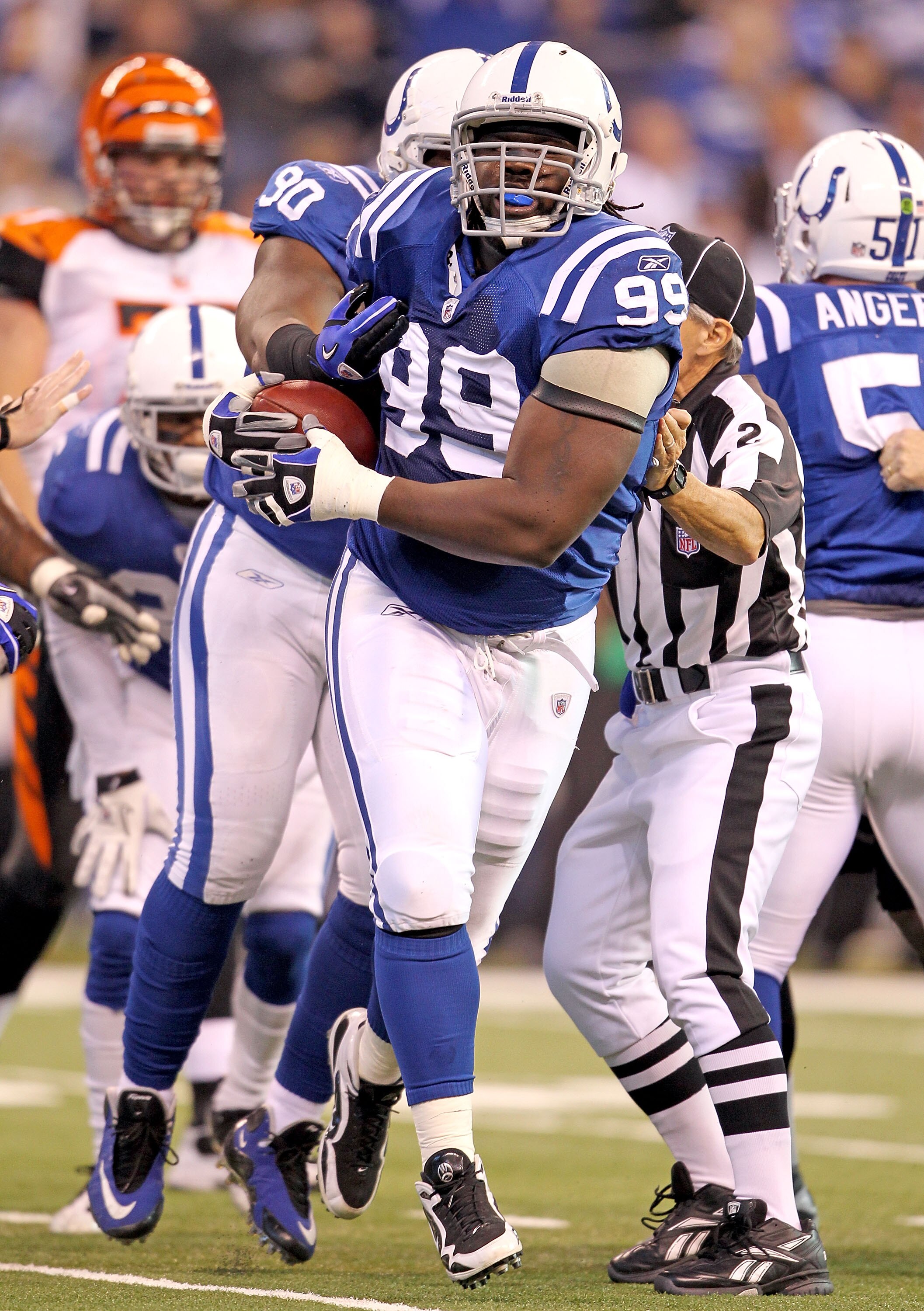 INDIANAPOLIS - NOVEMBER 14:  Antonio Johnson #99 of the Indianapolis Colts celebrates recovering a fumble during the NFL game against the Cincinnati Bengals at Lucas Oil Stadium on November 14, 2010 in Indianapolis, Indiana. The Colts won 23-17 (Photo by