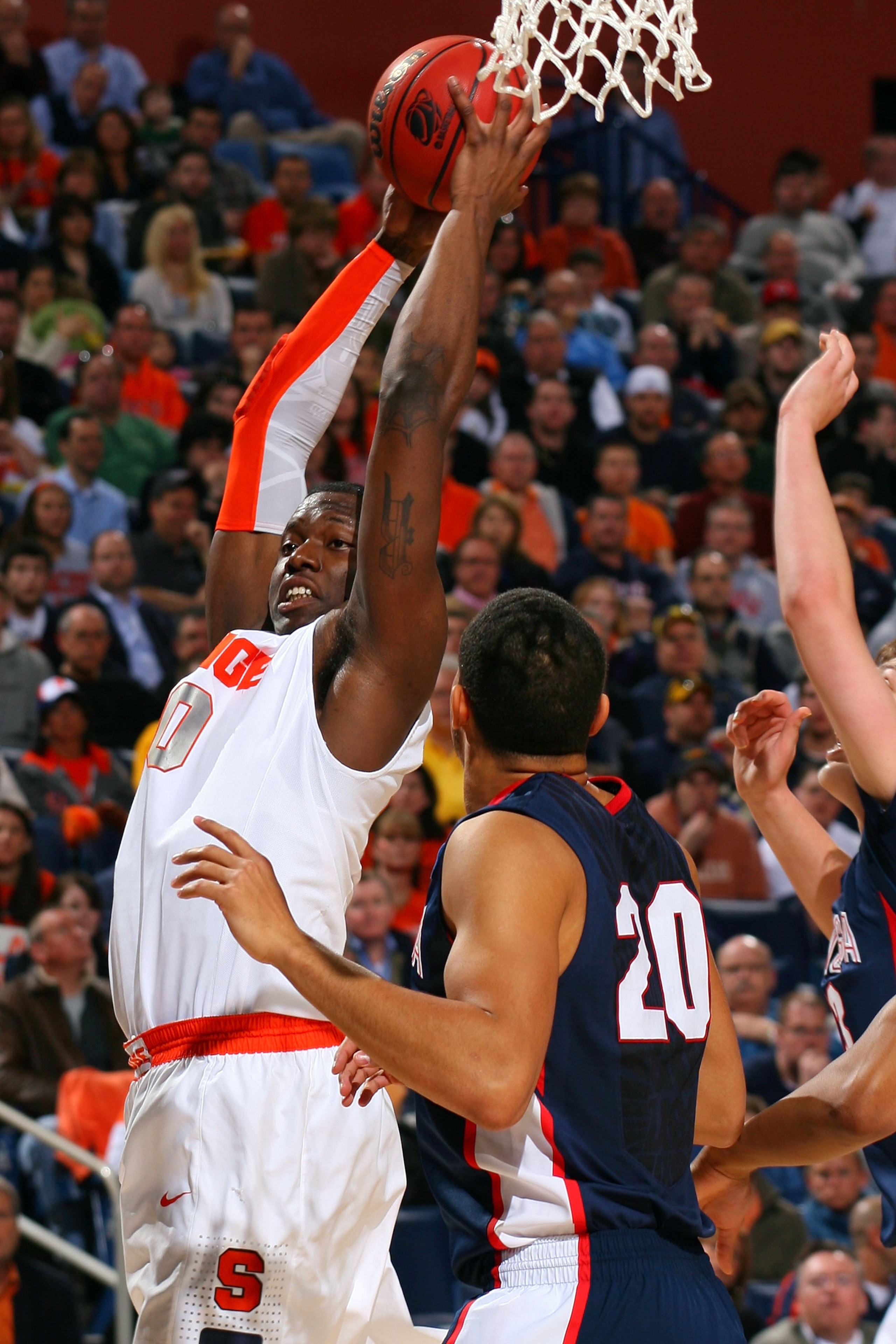 BUFFALO, NY - MARCH 21:  Rick Jackson #00 of the Syracuse Orange grabs the rebound against Elias Harris #20 of the Gonzaga Bulldogs during the second round of the 2010 NCAA men's basketball tournament at HSBC Arena at HSBC Arena on March 21, 2010 in Buffa