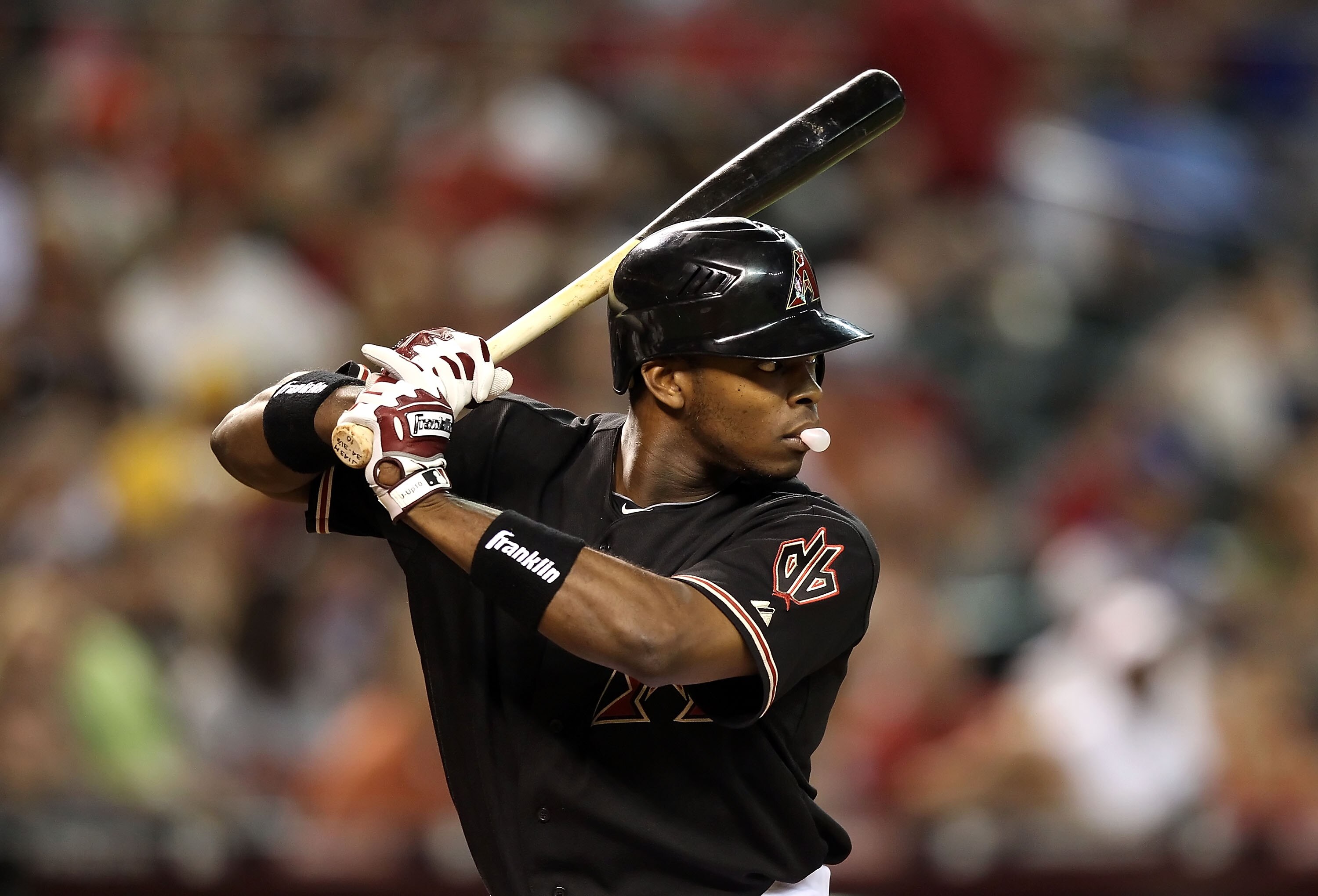 PHOENIX - JULY 03:  Justin Upton #10 of the Arizona Diamondbacks at bat during the Major League Baseball game against the Los Angeles Dodgers at Chase Field on July 3, 2010 in Phoenix, Arizona.  (Photo by Christian Petersen/Getty Images)