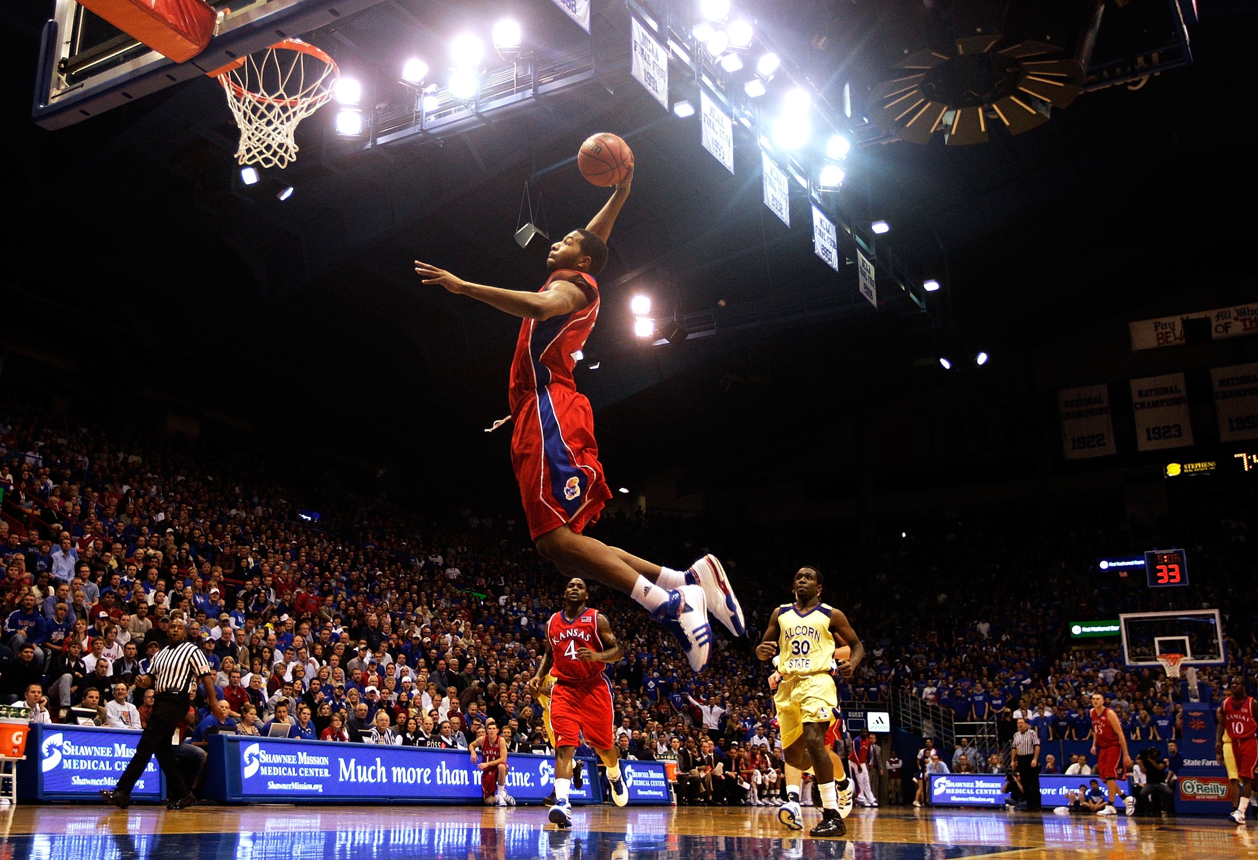 LAWRENCE, KS - DECEMBER 02:  Markieff Morris #21 of the Kansas Jayhawks dunks on a fast break during the game against  the Alcorn State Braves on December 2, 2009 at Allen Fieldhouse in Lawrence, Kansas.  (Photo by Jamie Squire/Getty Images)