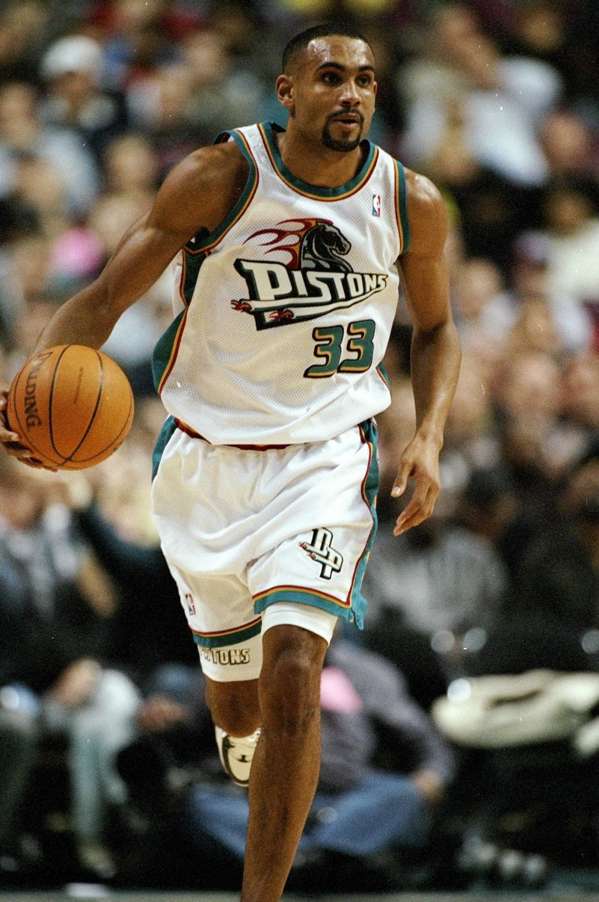 26 Dec 1997:  Grant Hill of the Detroit Pistons runs towards the basket in a match between the Detroit Pistons v Miami Heat in the NBA League played at the Palace of Auburn Hills , Auburn Hills, Miami, USA. Miami Heat won the game 88-74. \ Mandatory Credi