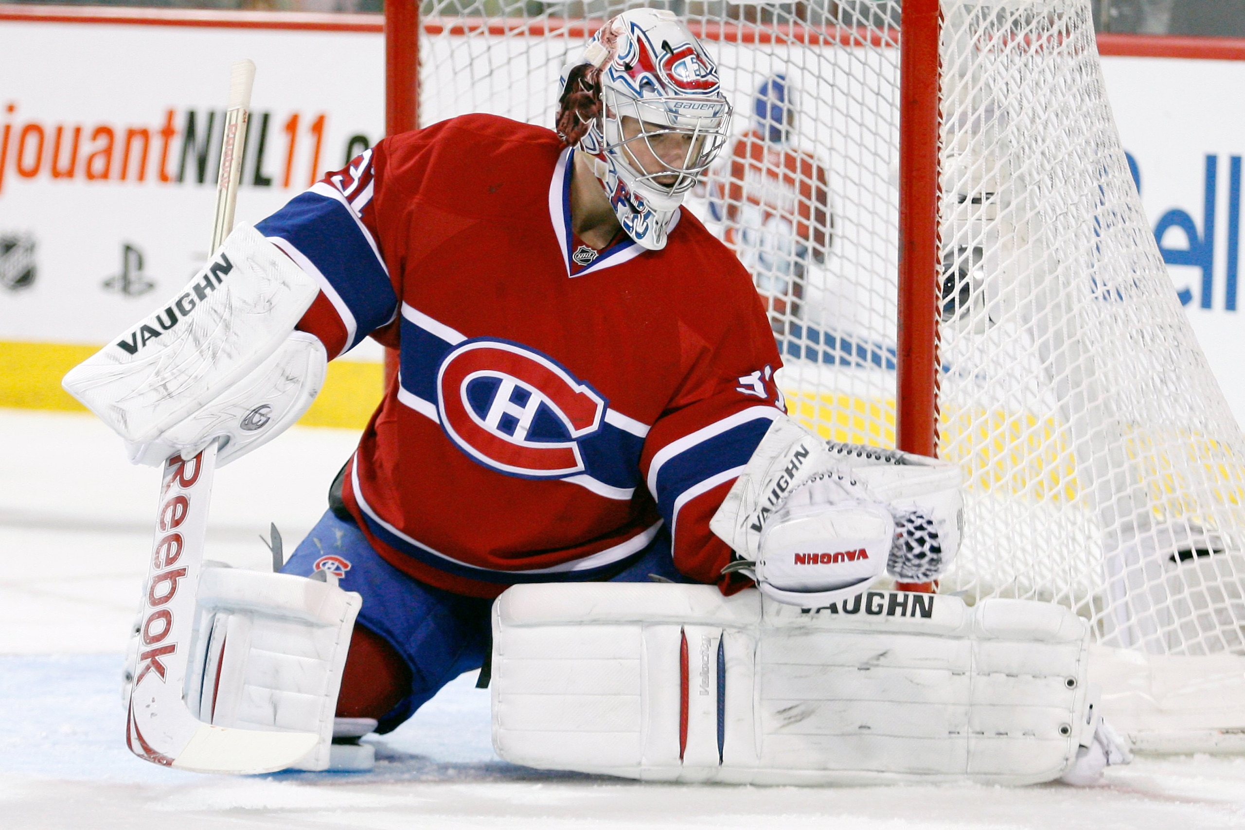 MONTREAL- NOVEMBER 9:  Carey Price #31 of the Montreal Canadiens makes a glove save on the puck during the NHL game against the Vancouver Canucks at the Bell Centre on November 9, 2010 in Montreal, Quebec, Canada.  The Canadiens defeated the Canucks 2-0.