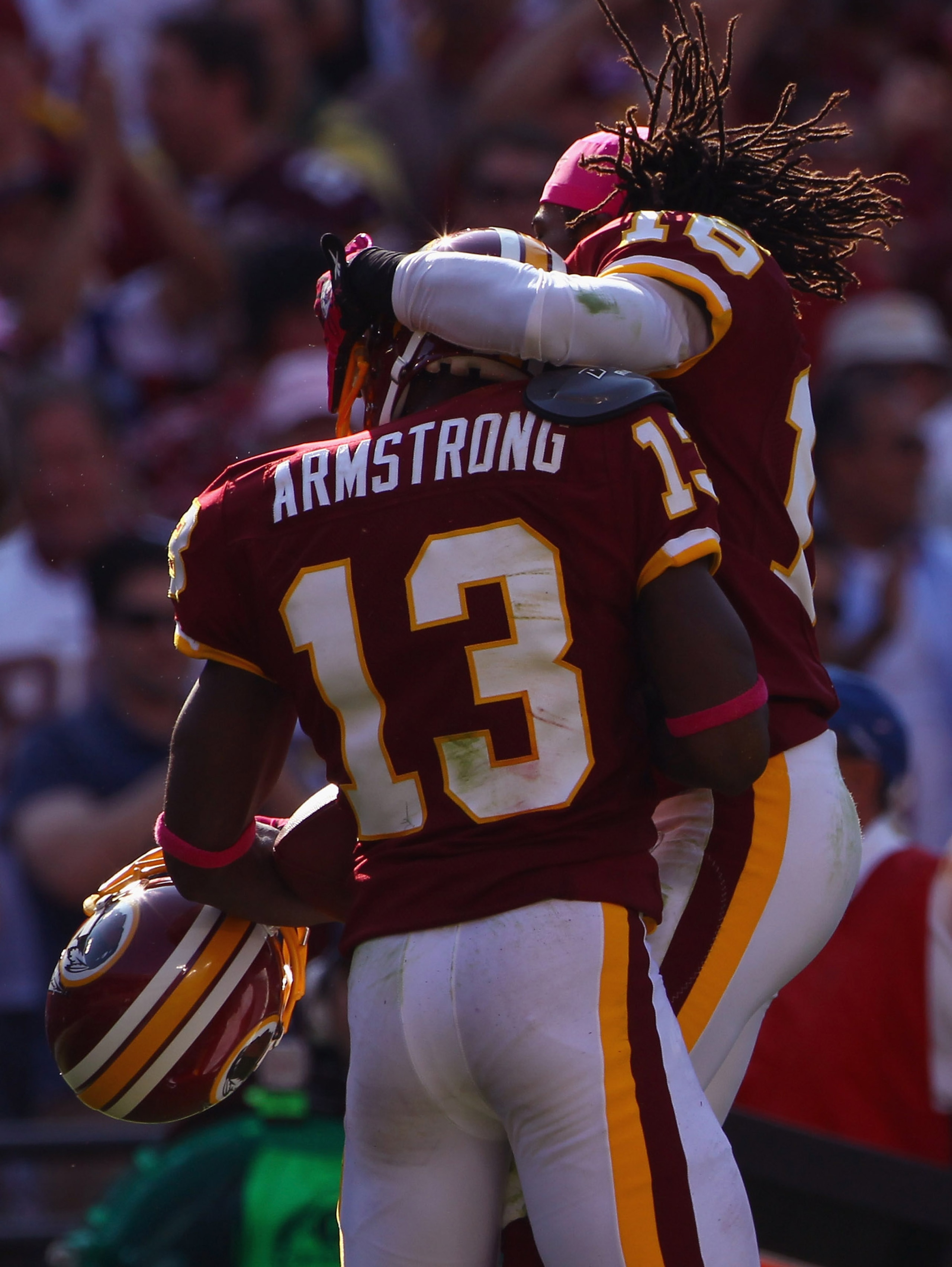 LANDOVER, MD - OCTOBER 10: Wide receiver Anthony Armstrong #13 of the Washington Redskins celebrates with teammate Brandon Banks #16 after Armstrong caught a touchdown pass in the fourth quarter against the Green Bay Packers at FedExField on October 10, LANDOVER, MD - OCTOBER 10: Wide receiver Anthony Armstrong #13 of the Washington Redskins celebrates with teammate Brandon Banks #16 after Armstrong caught a touchdown pass in the fourth quarter against the Green Bay Packers at FedExField on October 10,