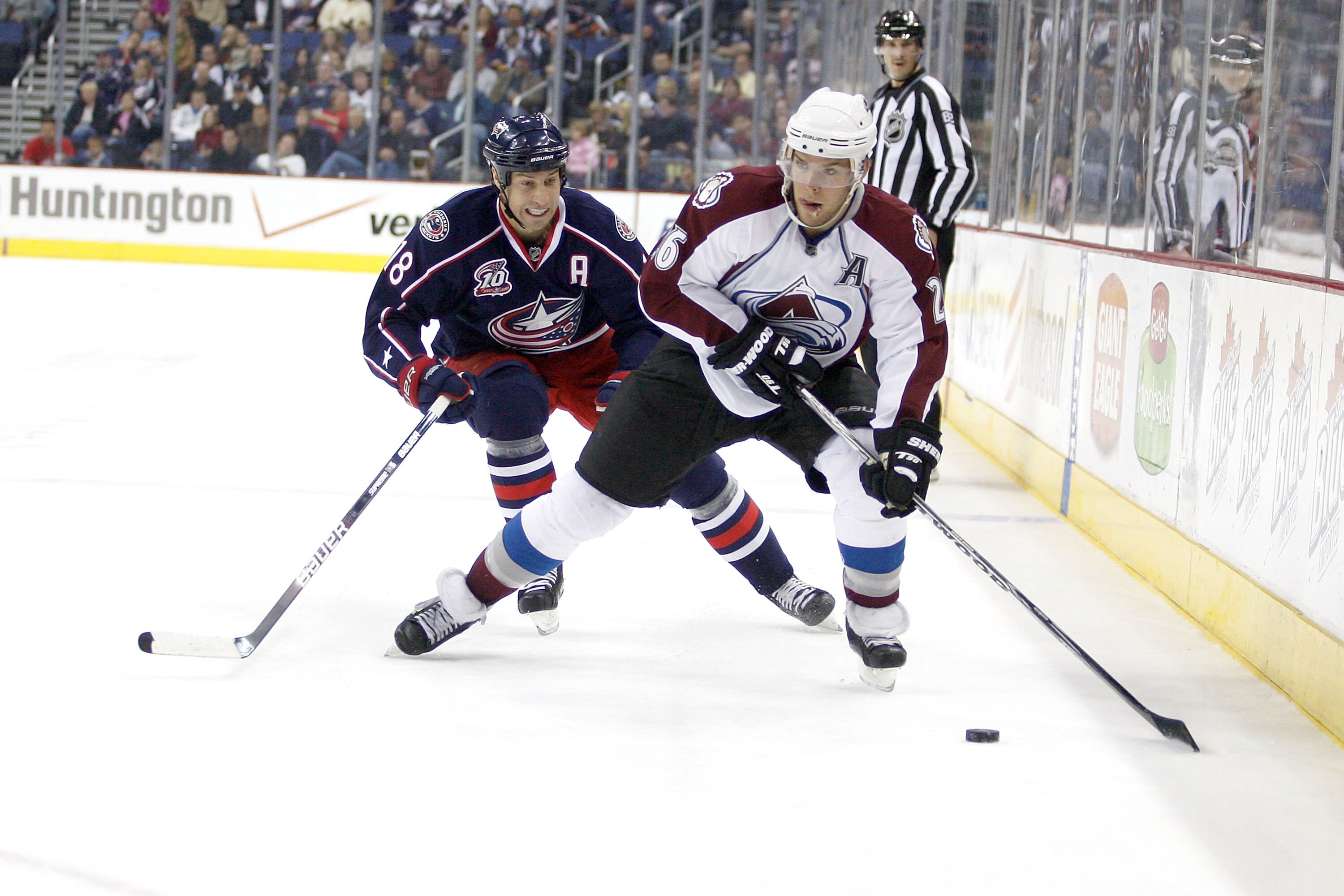 COLUMBUS,OH - NOVEMBER 12:  R.J. Umberger #18 of the Columbus Blue Jackets skates after Paul Stastny #26 of the Colorado Avalanche on November 12, 2010 at Nationwide Arena in Columbus, Ohio.  (Photo by John Grieshop/Getty Images)