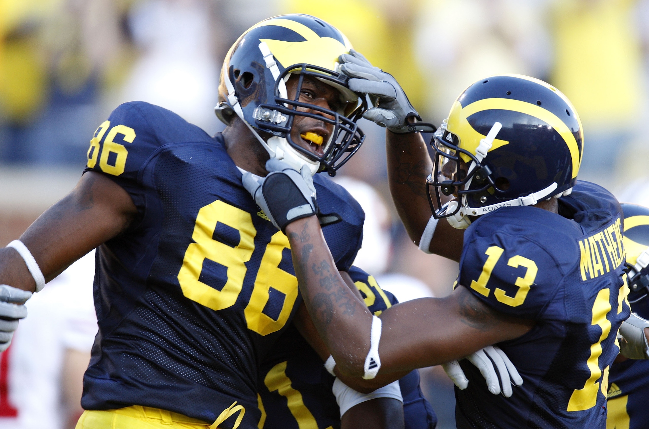 ANN ARBOR, MI - SEPTEMBER 27:  Kevin Koger #86 and Greg Mathews #13 of the Michigan Wolverines celebrate a third quarter touchdown against the Wisconsin Badgers on September 27, 2008 at Michigan Stadium in Ann Arbor, Michigan. (Photo by Gregory Shamus/Get