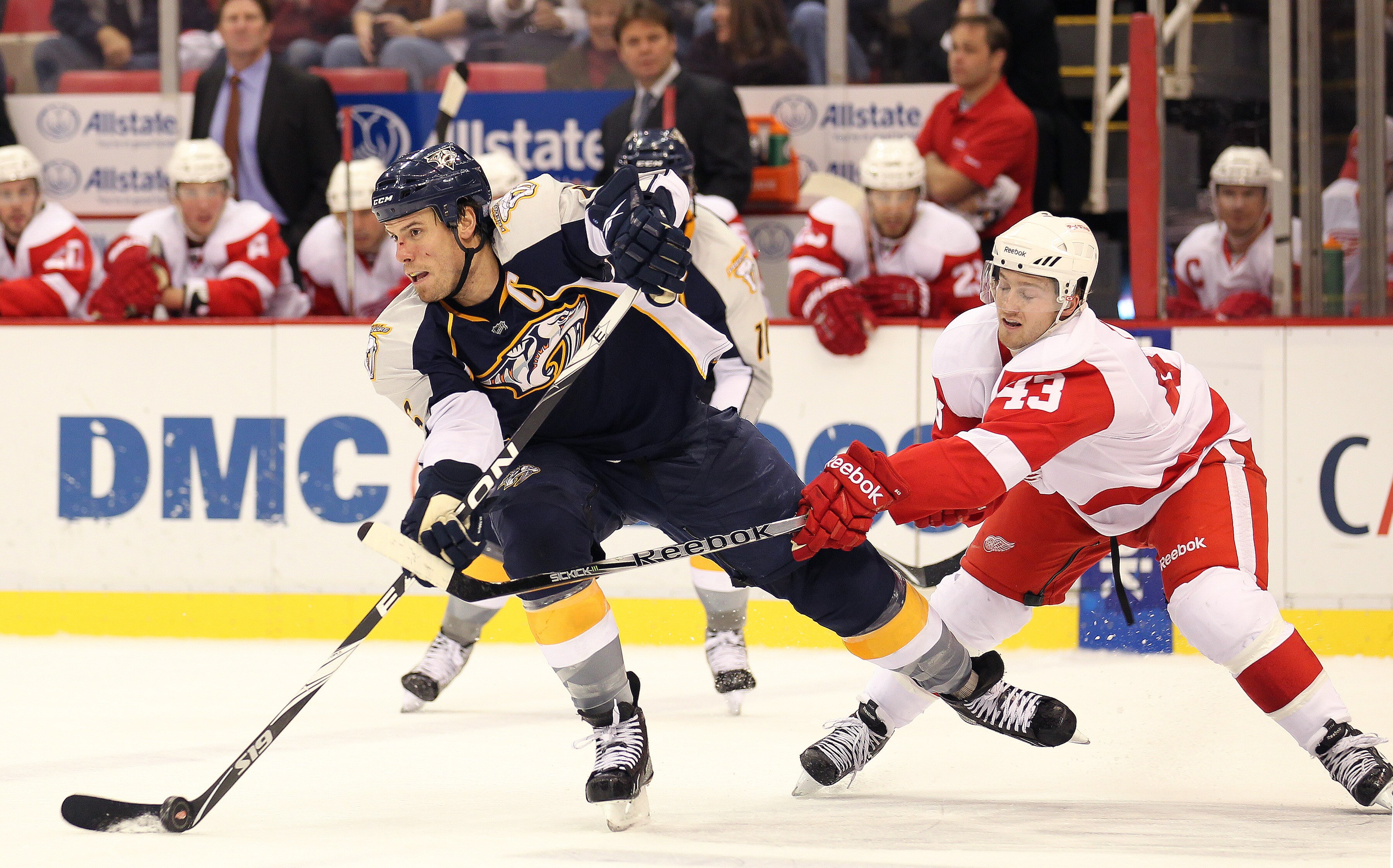 DETROIT - OCTOBER 30:  Darren Helm #43 of the Detroit Red Wings tries to check Shea Weber #6 of the Nashville Predators in a game on October 30, 2010 at the Joe Louis Arena in Detroit , Michigan. The Wings defeated the Predators 5-2. (Photo by Claus Ander