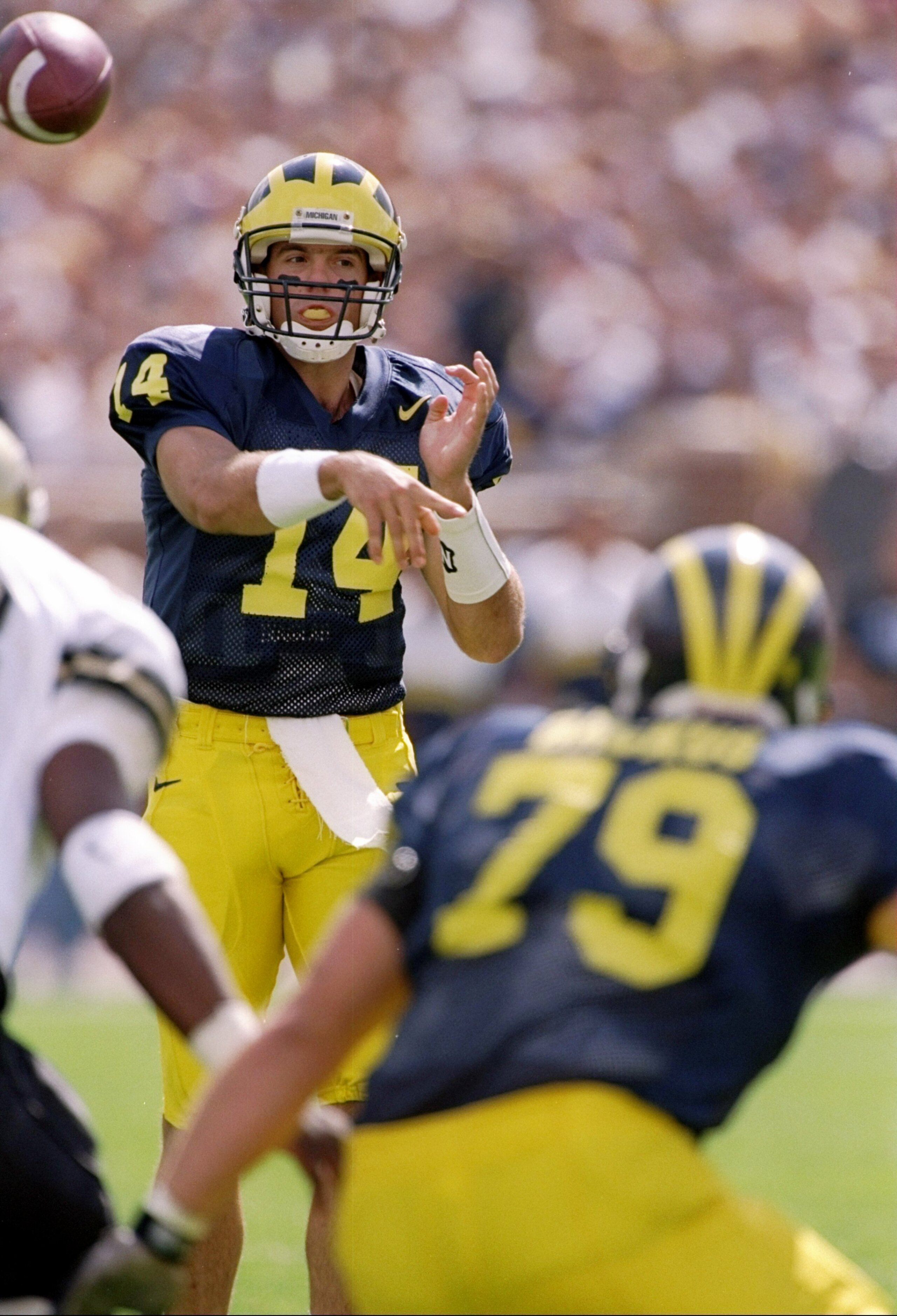 13 Sep 1997:  Quarterback Brian Briese #14 and left tackle Jeff Backus #79 of the of the Michigan Wolverines in action during a game against the Colorado Buffaloes.  Michigan won the game 27-3. Mandatory Credit: Jonathan Daniel  /Allsport