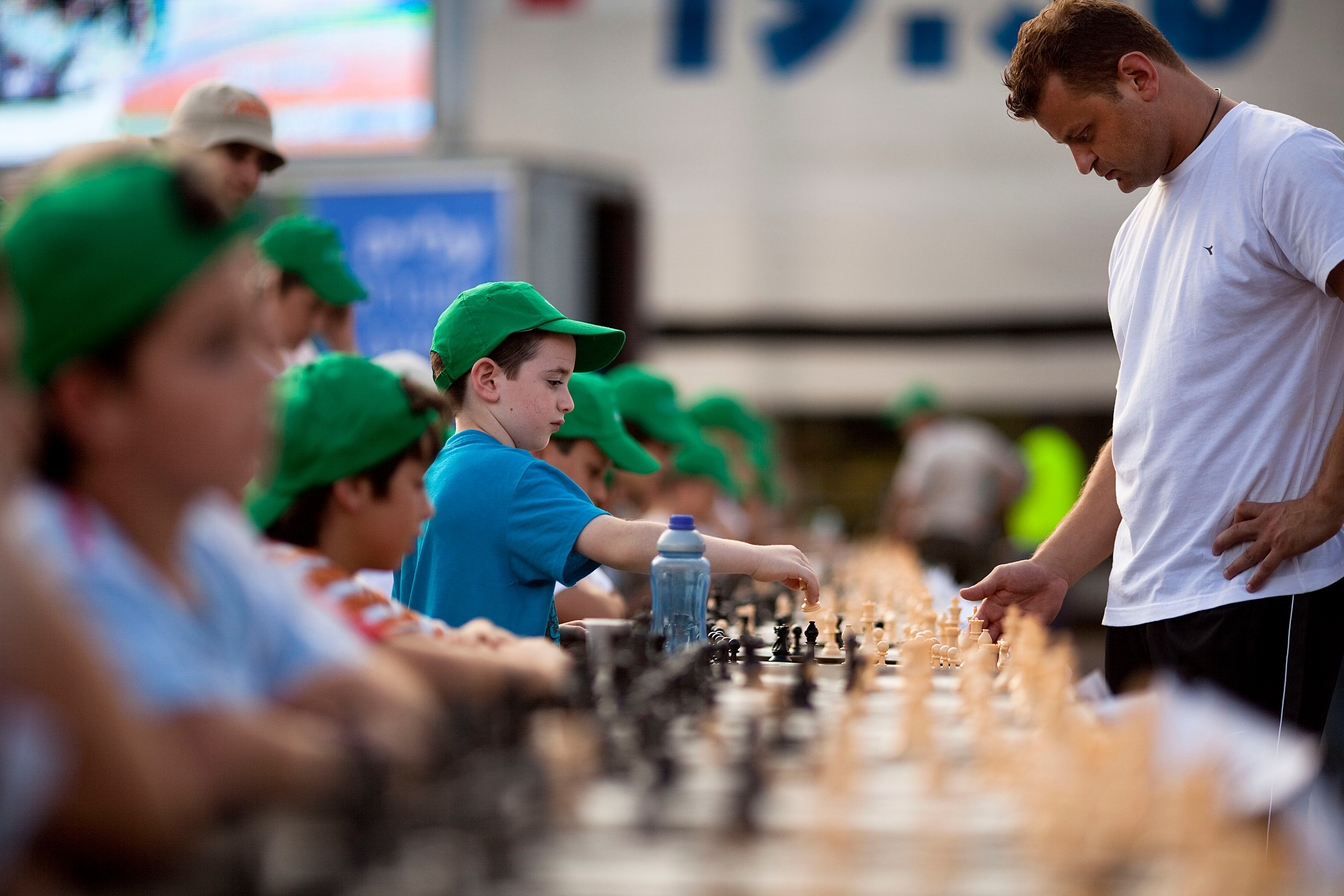 TEL AVIV, ISRAEL - OCTOBER 21: (ISRAEL OUT) Israeli chess Grandmaster Alik Gershon (R), makes a move during an attempt to break the Guinness world record of simultaneous chess play on October 21, 2010 in Tel Aviv, Israel. Hundreds of chess players in Isra
