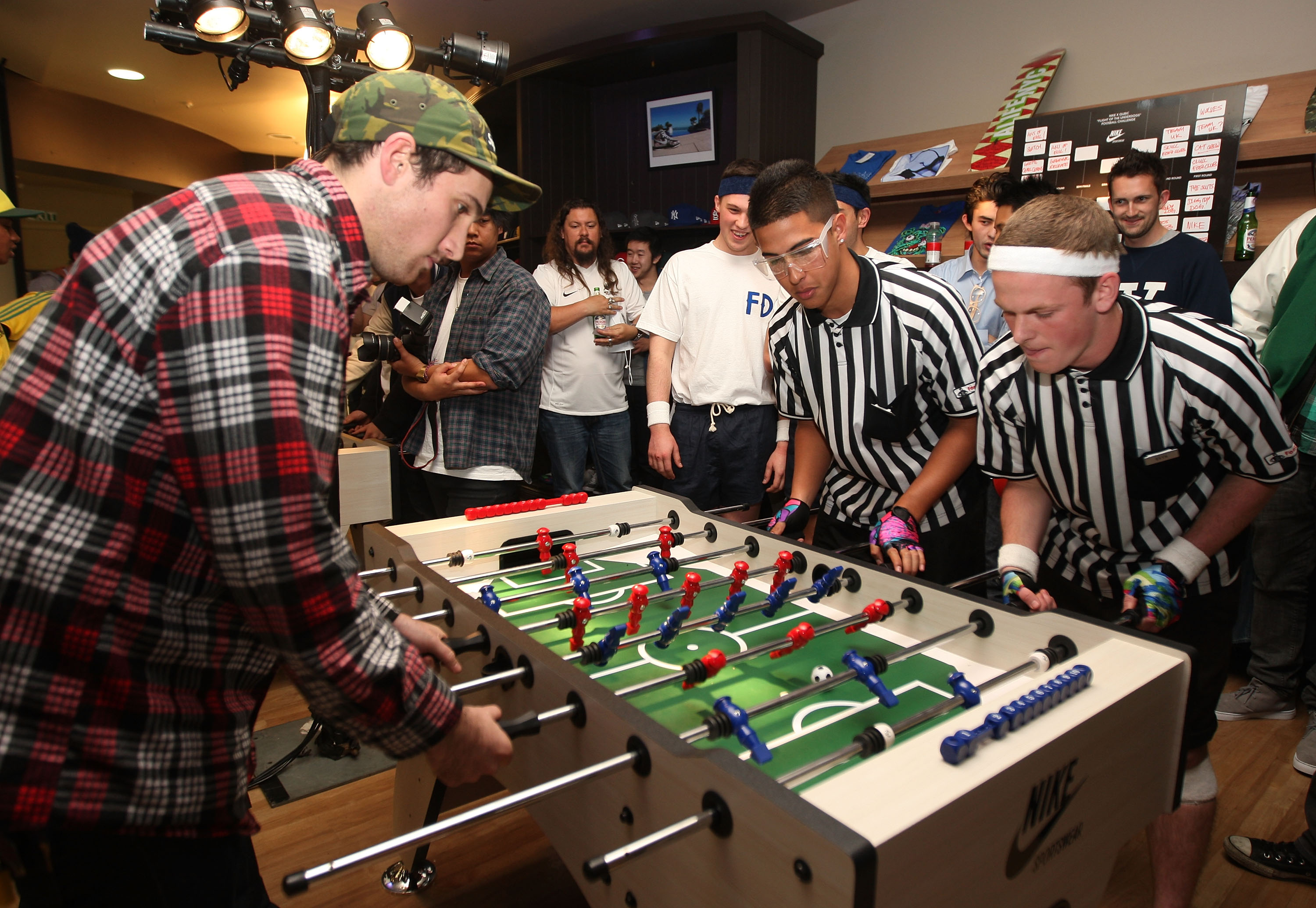 AUCKLAND, NEW ZEALAND - JUNE 15:  All White supporters play foosball inside the retail shop Qubic during a Nike function to watch the match between New Zealand and Slovakia at the 2010 World Cup in South Africa  on June 15, 2010 in Auckland, New Zealand.