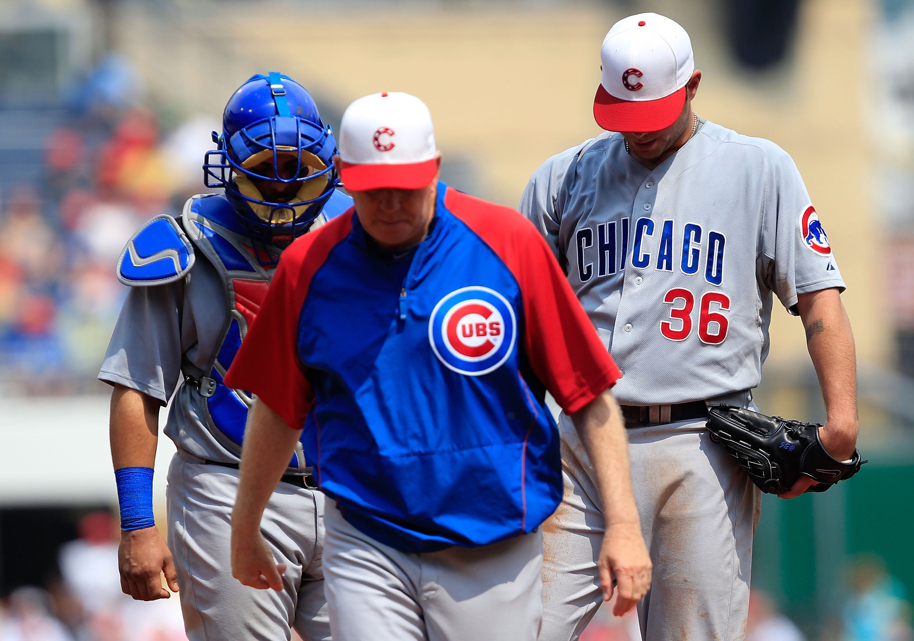 PITTSBURGH - MAY 31:  Pitching coach Larry Rothschild #50 and Geovany Soto #18 of the Chicago Cubs walk away after talking with teammate Randy Wells #36 during the game against the Pittsburgh Pirates on May 31, 2010 at PNC Park in Pittsburgh, Pennsylvania