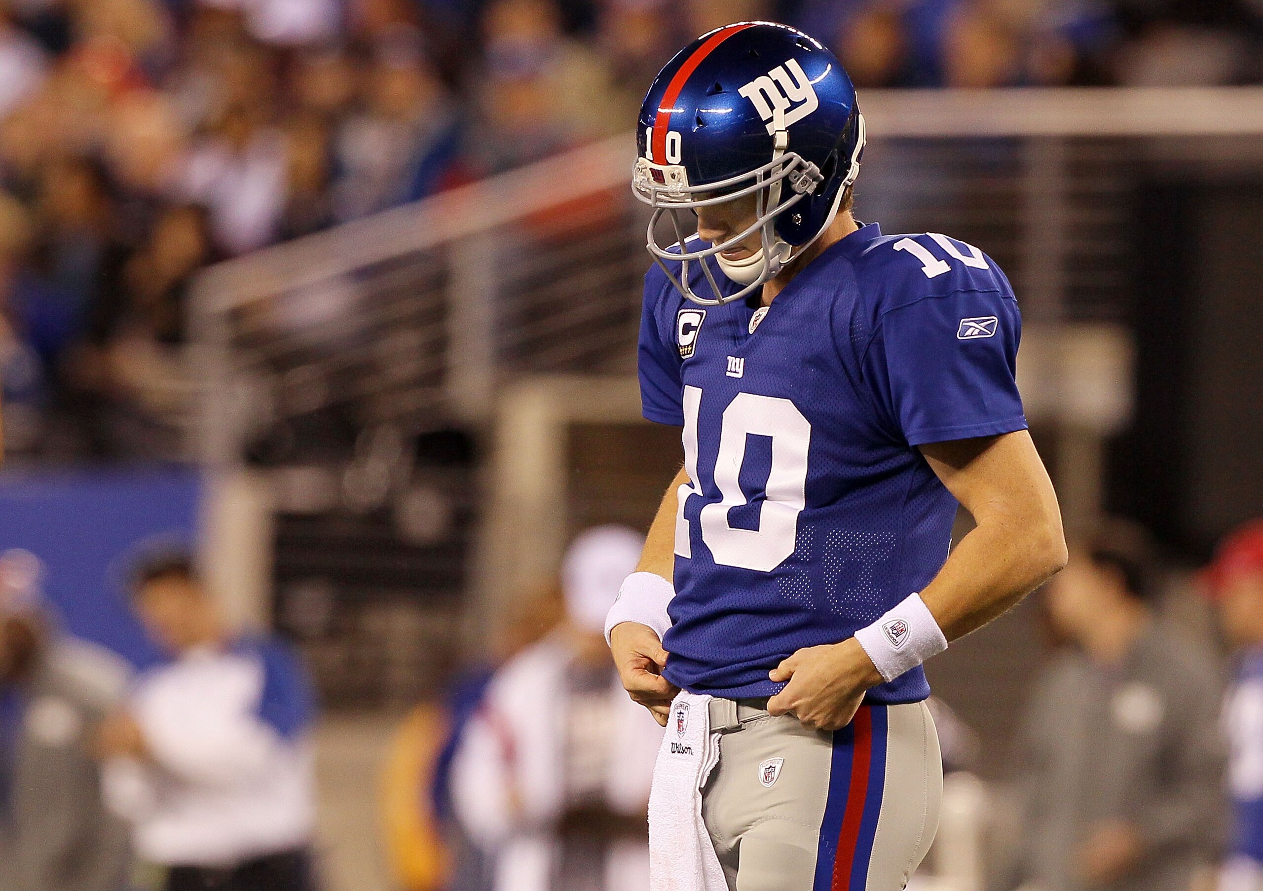 EAST RUTHERFORD, NJ - NOVEMBER 14:  Eli Manning #10 of the New York Giants looks on against the Dallas Cowboys on November 14, 2010 at the New Meadowlands Stadium in East Rutherford, New Jersey.  (Photo by Jim McIsaac/Getty Images)