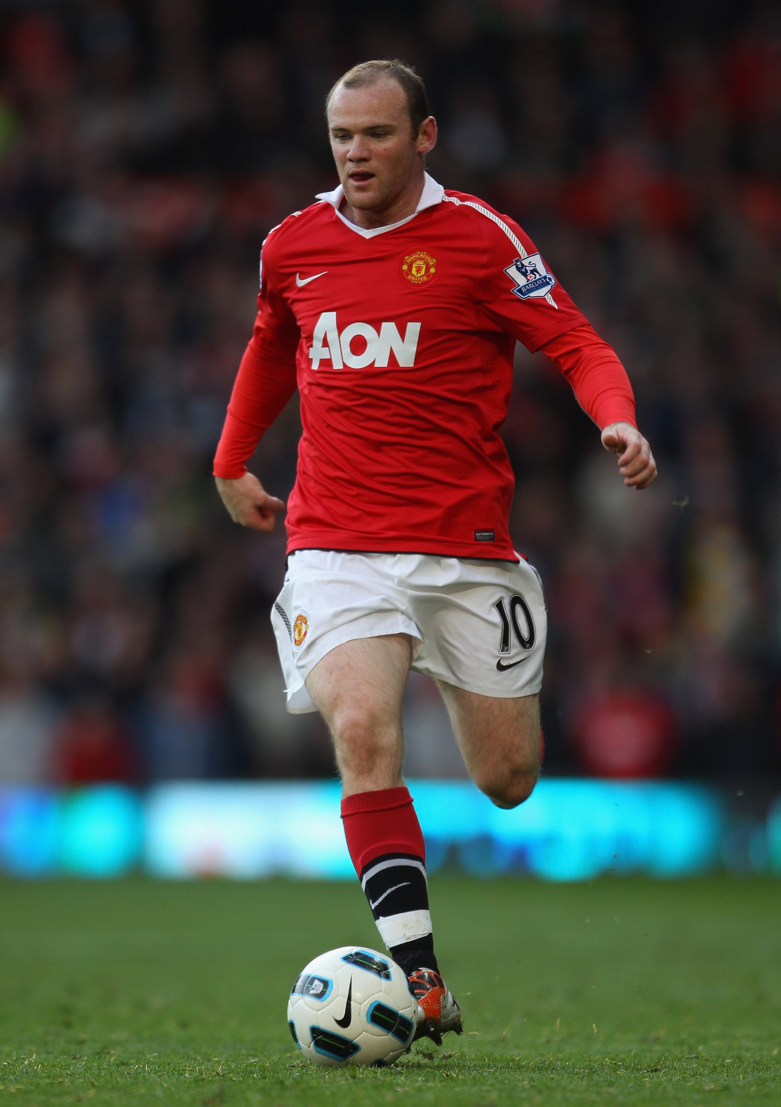 MANCHESTER, ENGLAND - OCTOBER 16: Wayne Rooney of Manchester United runs with the ball during the Barclays Premier League match between Manchester United and West Bromwich Albion at Old Trafford on October 16, 2010 in Manchester, England. (Photo by Alex MANCHESTER, ENGLAND - OCTOBER 16: Wayne Rooney of Manchester United runs with the ball during the Barclays Premier League match between Manchester United and West Bromwich Albion at Old Trafford on October 16, 2010 in Manchester, England. (Photo by Alex