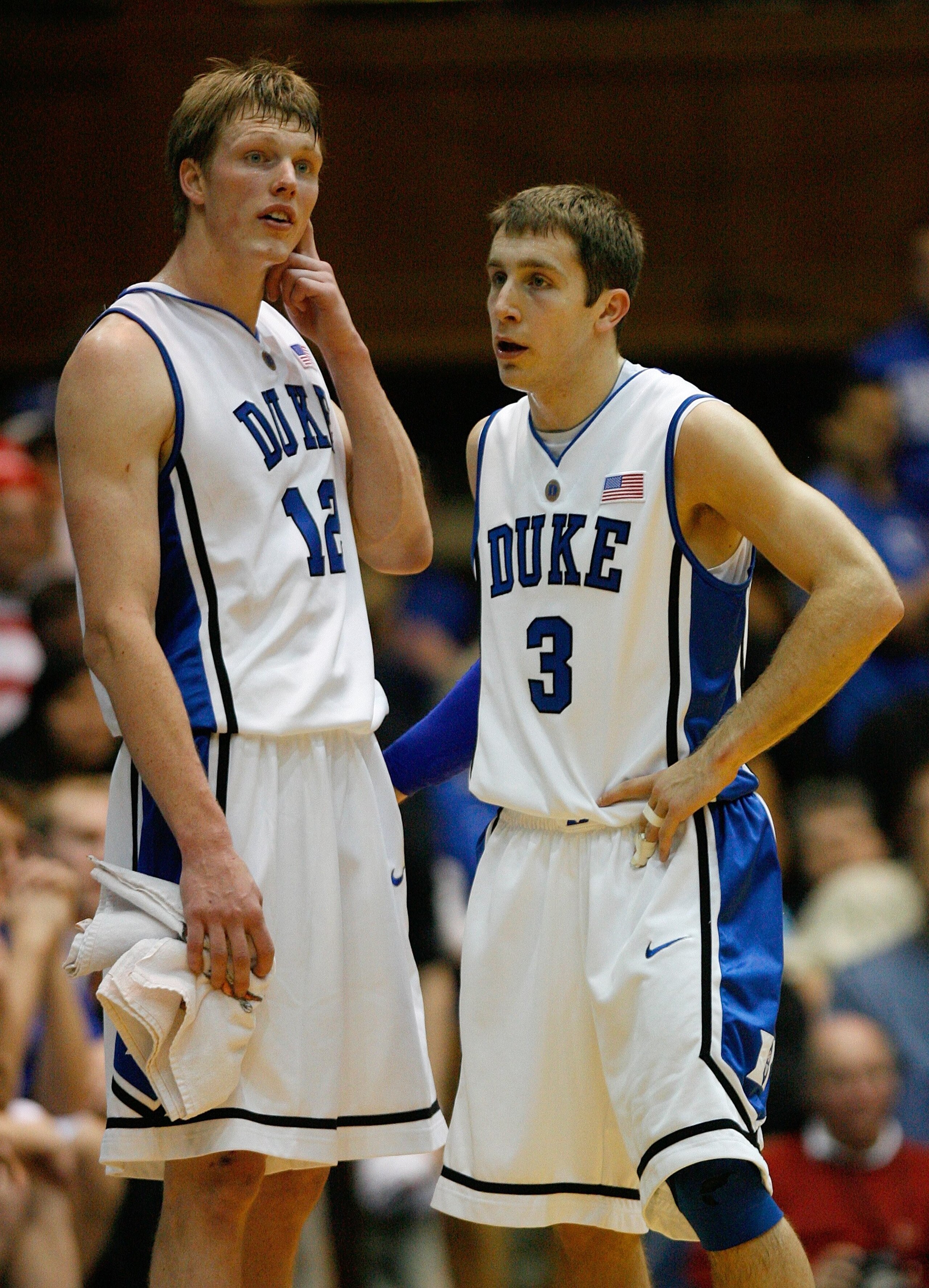 DURHAM, NC - JANUARY 17: Kyle Singler #12 and Greg Paulus #3 of Duke Blue Devils look on during a break in the game against the Georgetown Hoyas on January 17, 2009 at Cameron Indoor Stadium in Durham, North Carolina. The Blue Devils defeated the Hoyas DURHAM, NC - JANUARY 17: Kyle Singler #12 and Greg Paulus #3 of Duke Blue Devils look on during a break in the game against the Georgetown Hoyas on January 17, 2009 at Cameron Indoor Stadium in Durham, North Carolina. The Blue Devils defeated the Hoyas