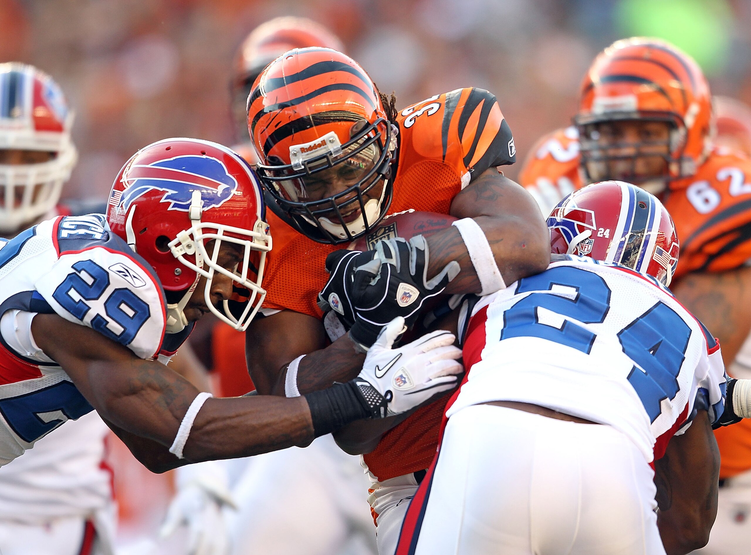 CINCINNATI - NOVEMBER 21:  Cedric Benson #32 of the Cincinnati Bengals is tackled by Drayton Florence  and Terrence McGee#29 of the Buffalo Bills during the NFL game at Paul Brown Stadium on November 21, 2010 in Cincinnati, Ohio.  (Photo by Andy Lyons/Get