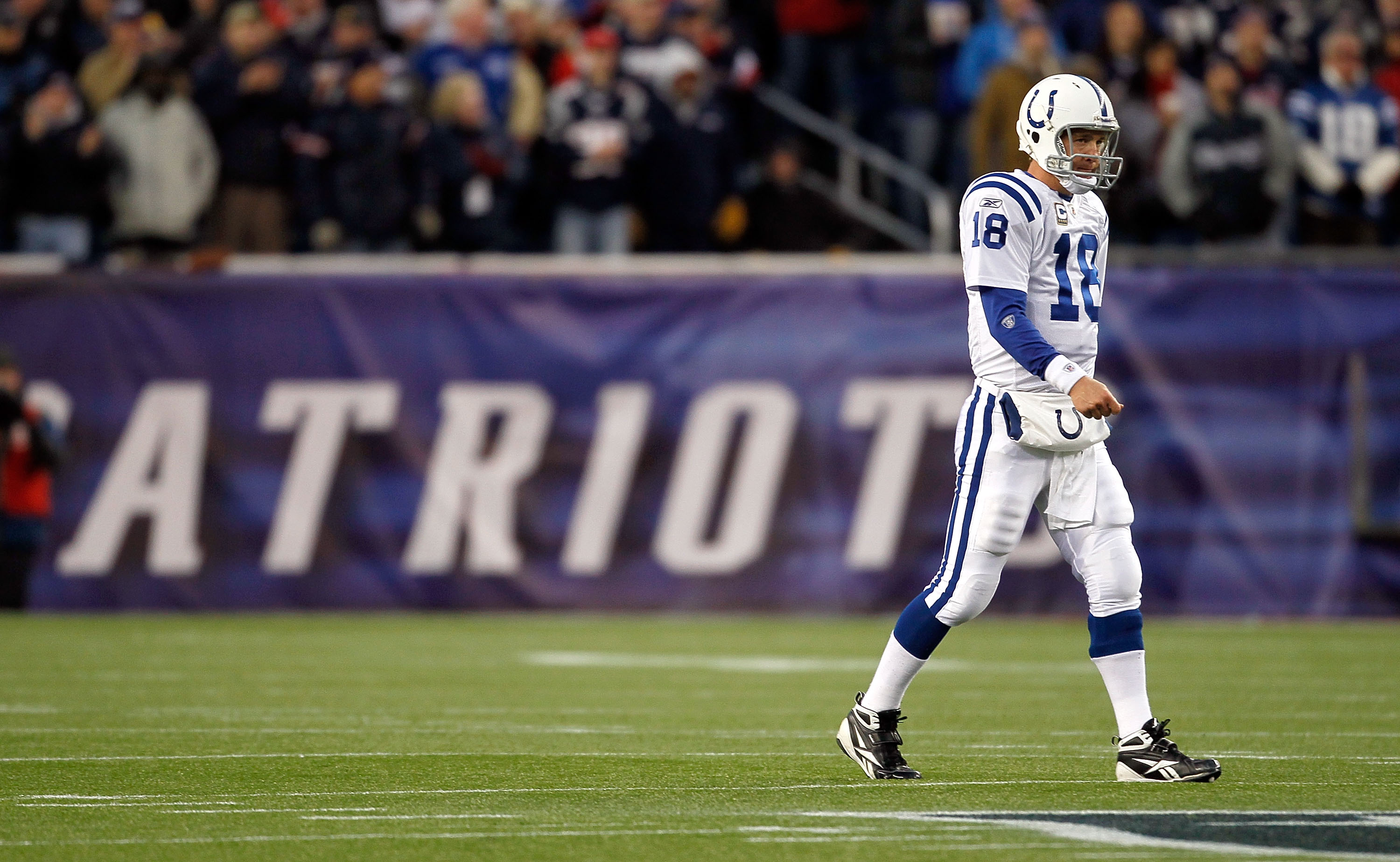 FOXBORO, MA - NOVEMBER 21:  Peyton Manning #18 of the Indianapolis Colts walks to the sideline in first half in a game against the New England Patriots at Gillette Stadium on November 21, 2010 in Foxboro, Massachusetts. The Patriots won 31-28. (Photo by J