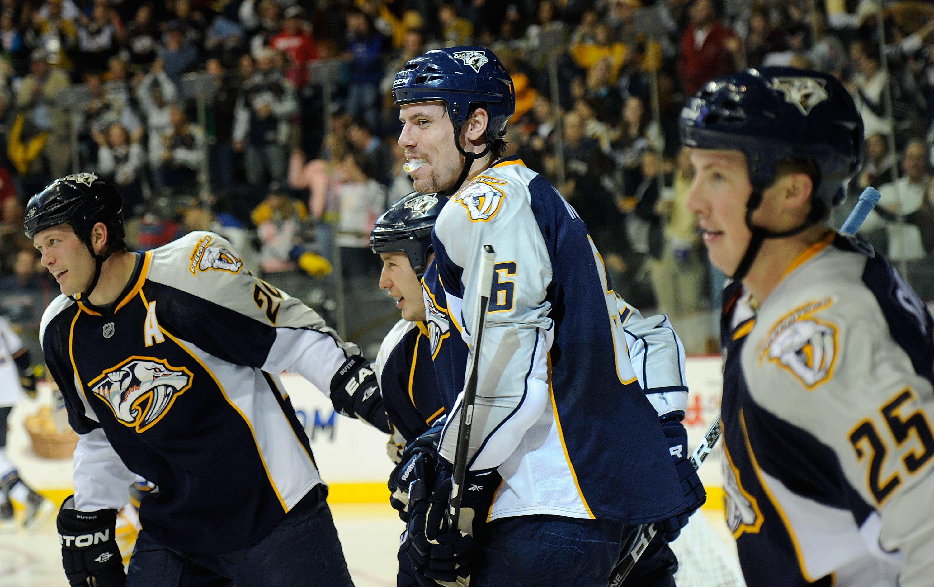 NASHVILLE, TN - NOVEMBER 24:  Ryan Suter #20, Jordin Tootoo #22, Shea Weber #6, and Jerred Smithson #25 of the Nashville Predators celebrate after a goal against the St. Louis Blues on November 24, 2010 at the Bridgestone Arena in Nashville, Tennessee.  (