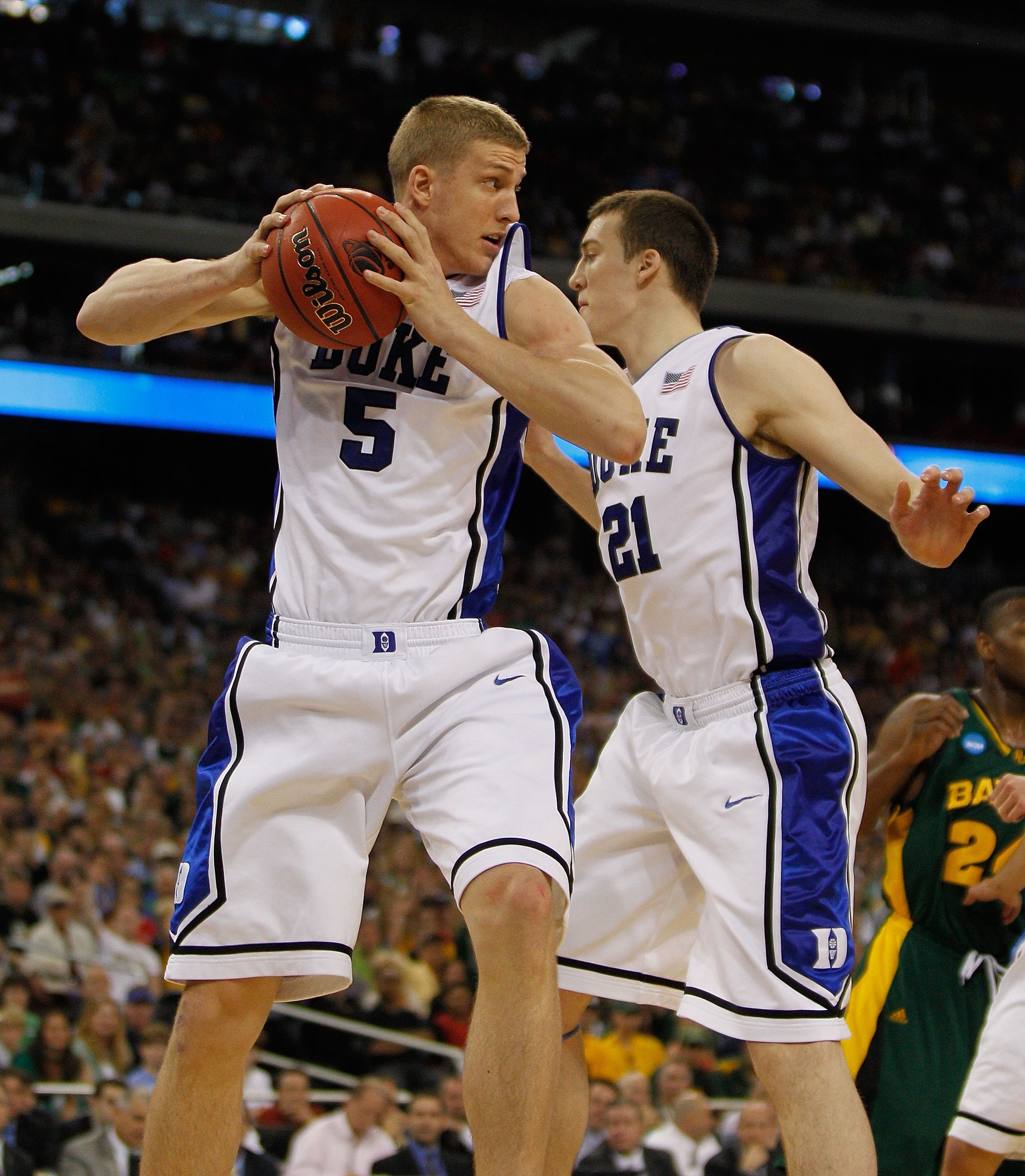 HOUSTON - MARCH 28: Mason Plumlee #5 of the Duke Blue Devils grabs a rebound in front of teammate Miles Plumlee #21 against the Baylor Bears during the south regional final of the 2010 NCAA men's basketball tournament at Reliant Stadium on March 28, 2010