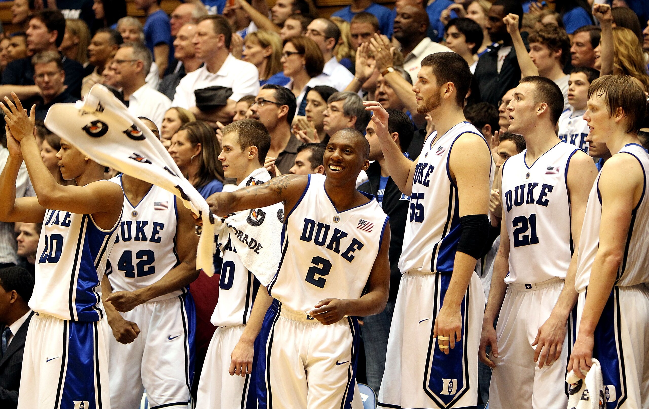 DURHAM, NC - MARCH 06: Nolan Smith #2 of the Duke Blue Devils celebrates with teammates on the bench during their 82-50 victory over the North Carolina Tar Heels during their game at Cameron Indoor Stadium on March 6, 2010 in Durham, North Carolina. (Ph DURHAM, NC - MARCH 06: Nolan Smith #2 of the Duke Blue Devils celebrates with teammates on the bench during their 82-50 victory over the North Carolina Tar Heels during their game at Cameron Indoor Stadium on March 6, 2010 in Durham, North Carolina. (Ph