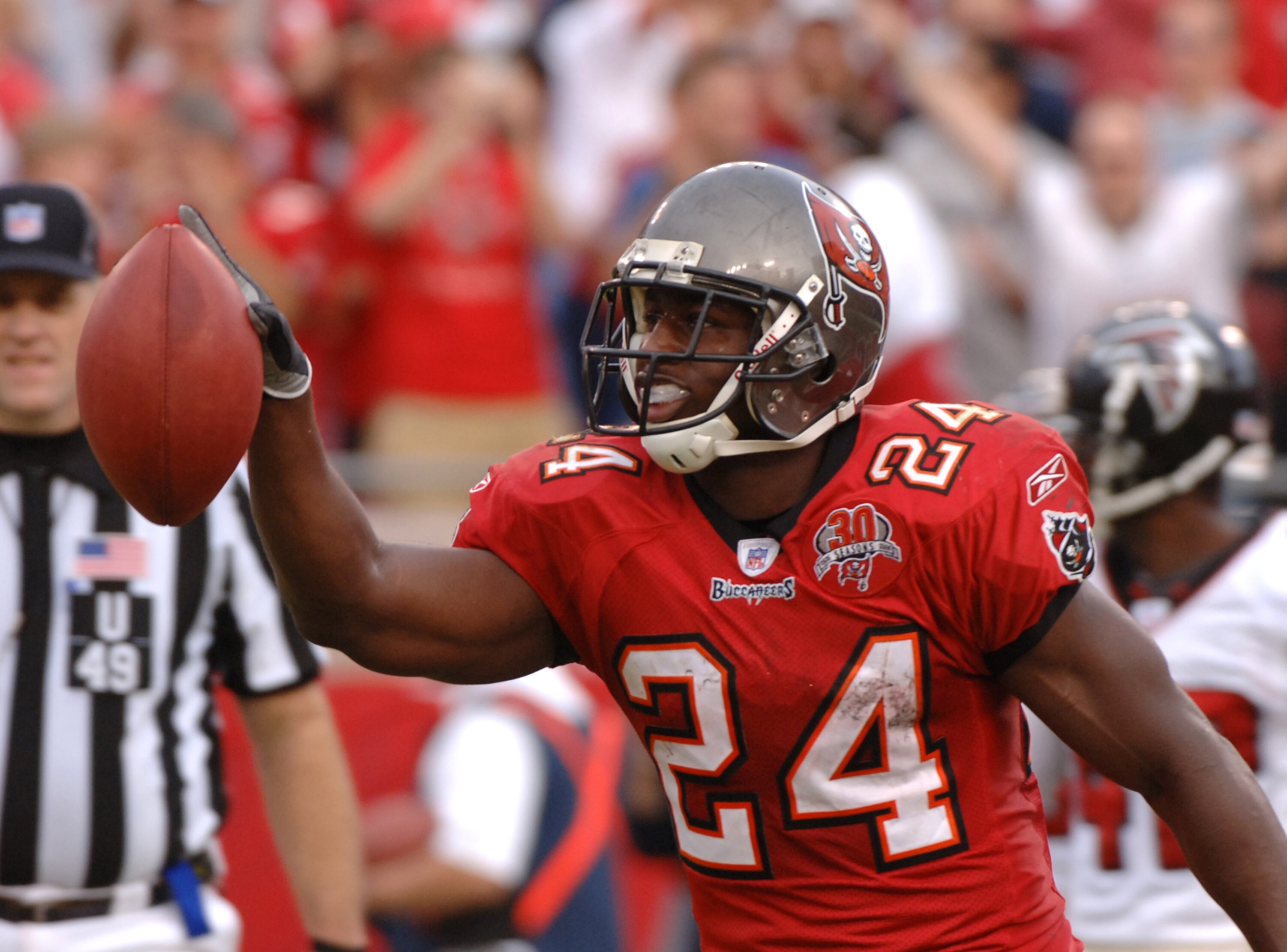 Tampa Bay Buccaneers runnning back Carnell Williams celebrates a touchdown run against the Atlanta Falcons Dec. 24, 2005 in Tampa.  Williams rushed for more than 100 yards as the Bucs won 27 - 23 in overtime.  (Photo by Al Messerschmidt/Getty Images)