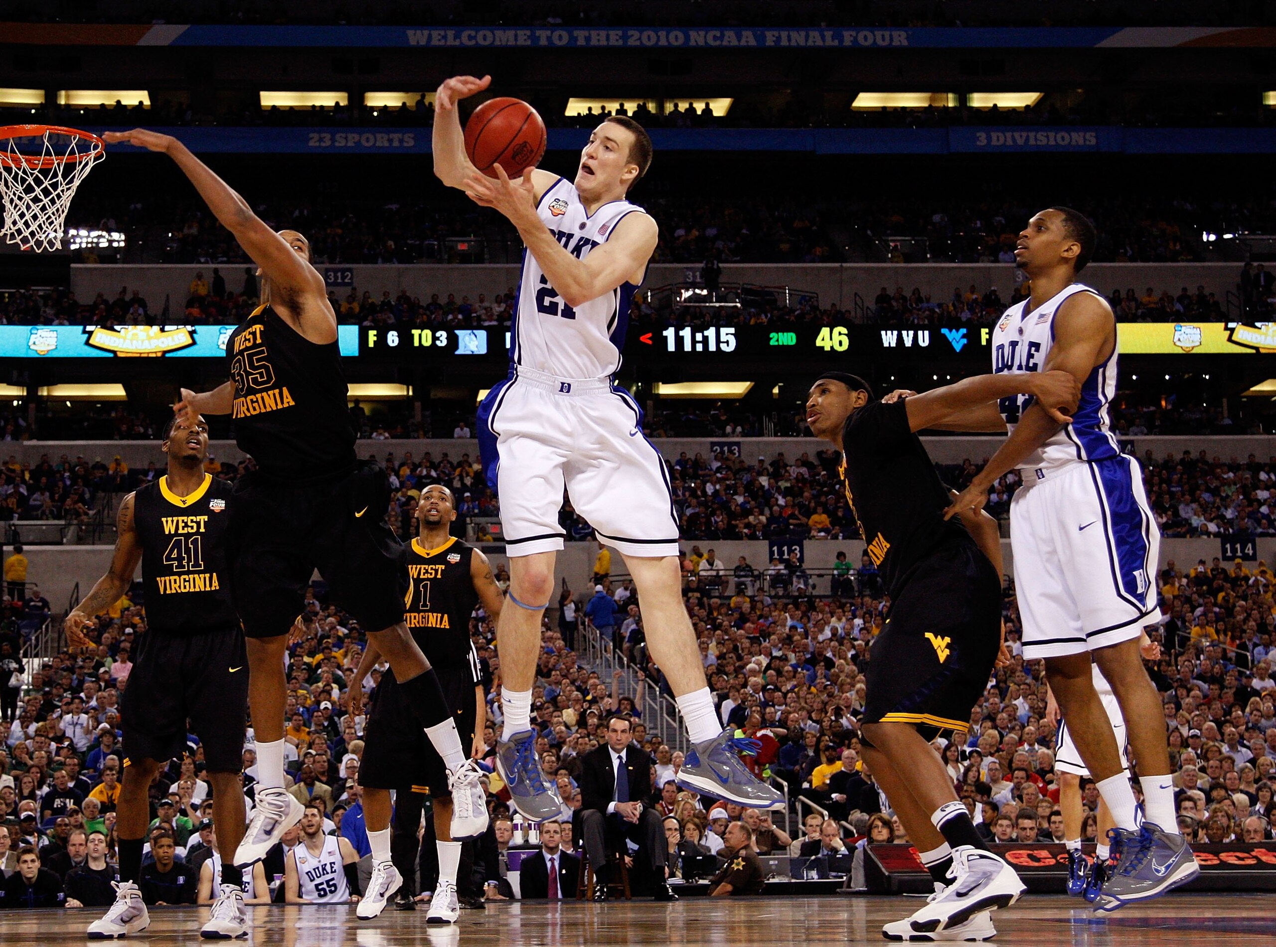 INDIANAPOLIS - APRIL 03: Miles Plumlee #21 of the Duke Blue Devils rebounds the ball while taking on the West Virginia Mountaineers during the National Semifinal game of the 2010 NCAA Division I Men's Basketball Championship at Lucas Oil Stadium on April INDIANAPOLIS - APRIL 03: Miles Plumlee #21 of the Duke Blue Devils rebounds the ball while taking on the West Virginia Mountaineers during the National Semifinal game of the 2010 NCAA Division I Men's Basketball Championship at Lucas Oil Stadium on April