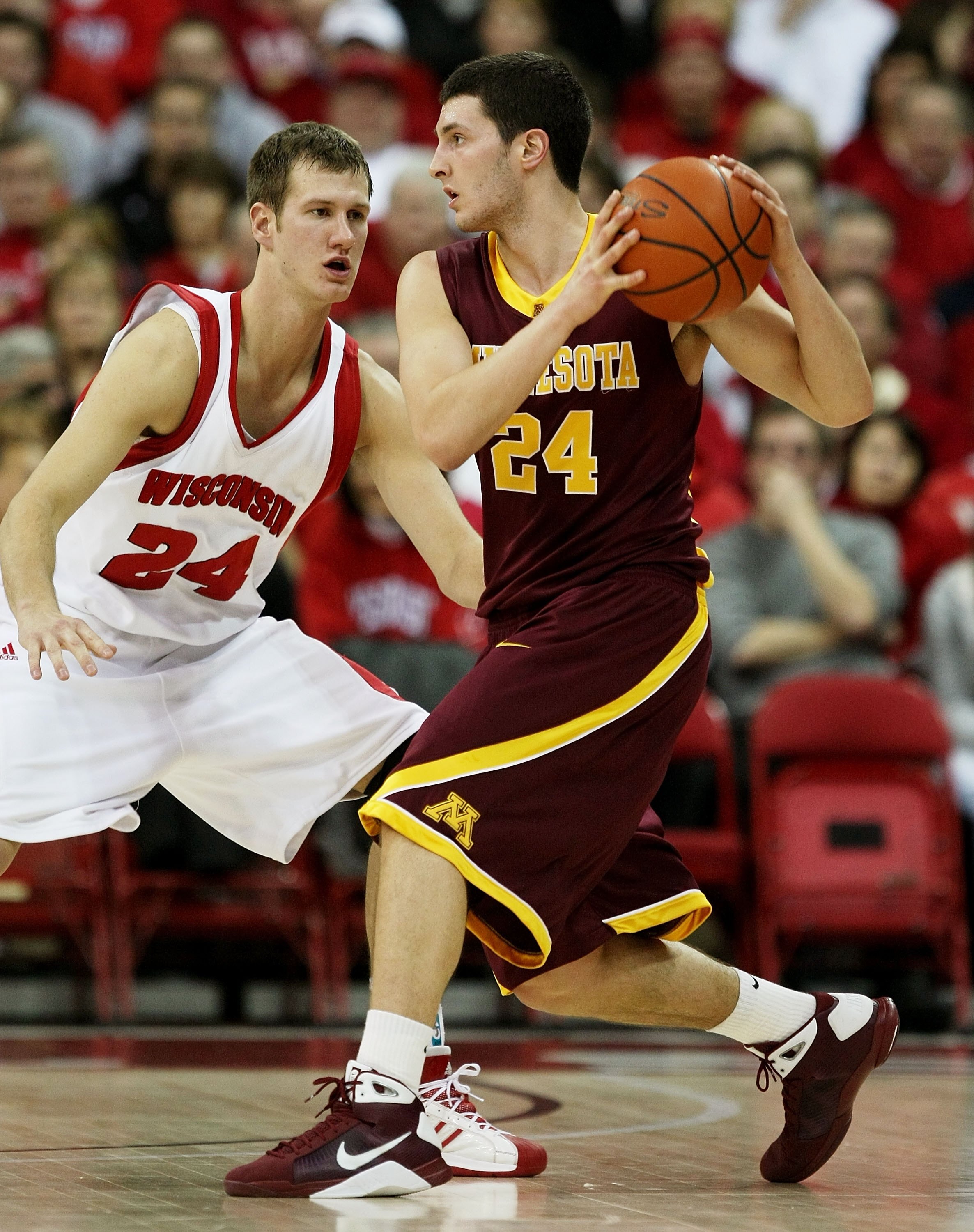 MADISON, WI - JANUARY 15: Blake Hoffarber #24 of the Minnesota Golden Gophers moves against Tim Jarmusz #24 of the Wisconsin Badgers on January 15, 2009 at the Kohl Center in Madison, Wisconsin. Minnesota defeated Wisconsin 78-74 in overtime. (Photo by Jo