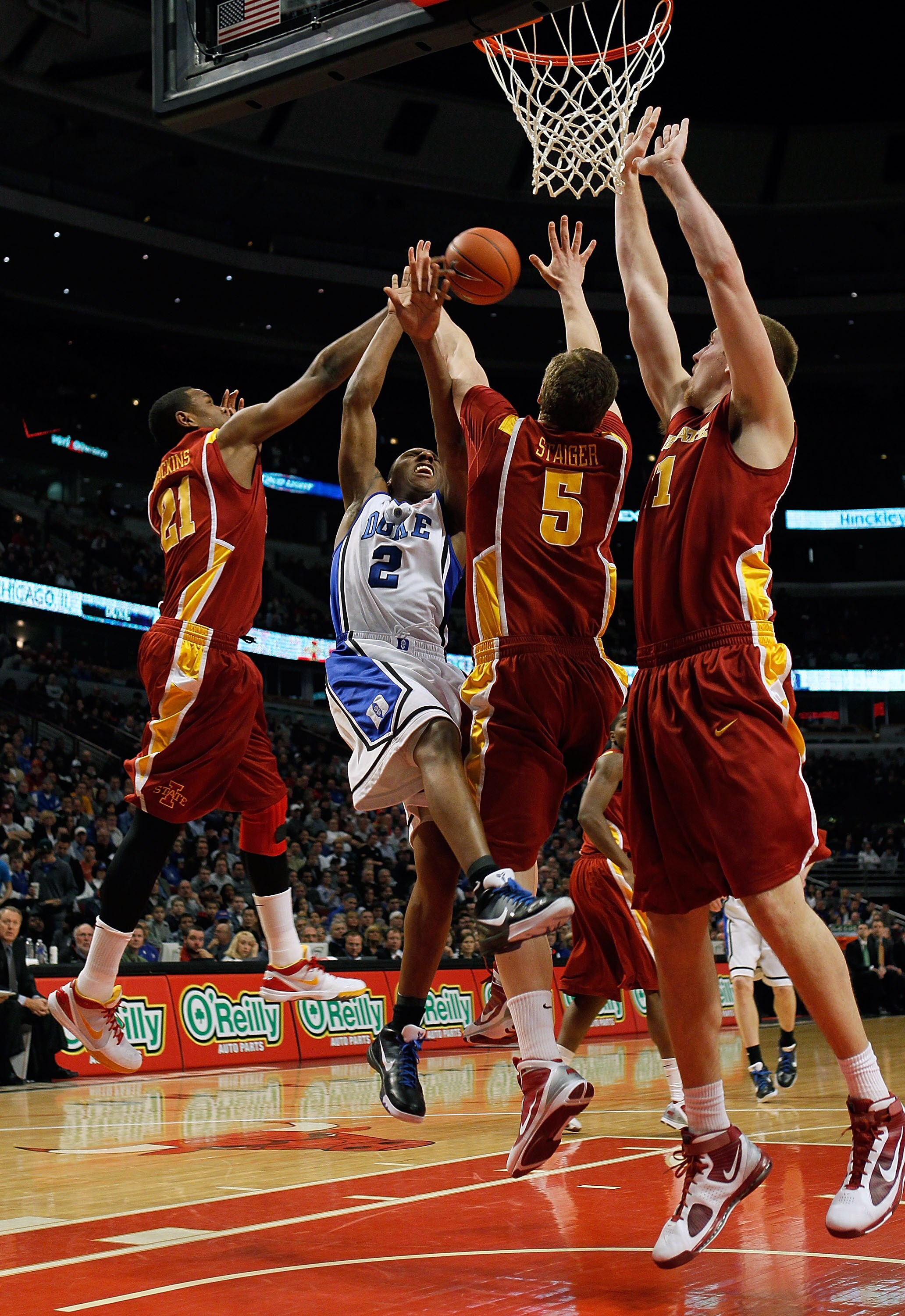 CHICAGO - JANUARY 06: Craig Brackins #21 of the Iowa State Cyclones blocks a shot by Nolan Smith #2 of the Duke Blue Devils as Lucca Staiger #5 and Justin Hamilton #41 of the Cyclones defend at the United Center on January 6, 2010 in Chicago, Illinois. (P