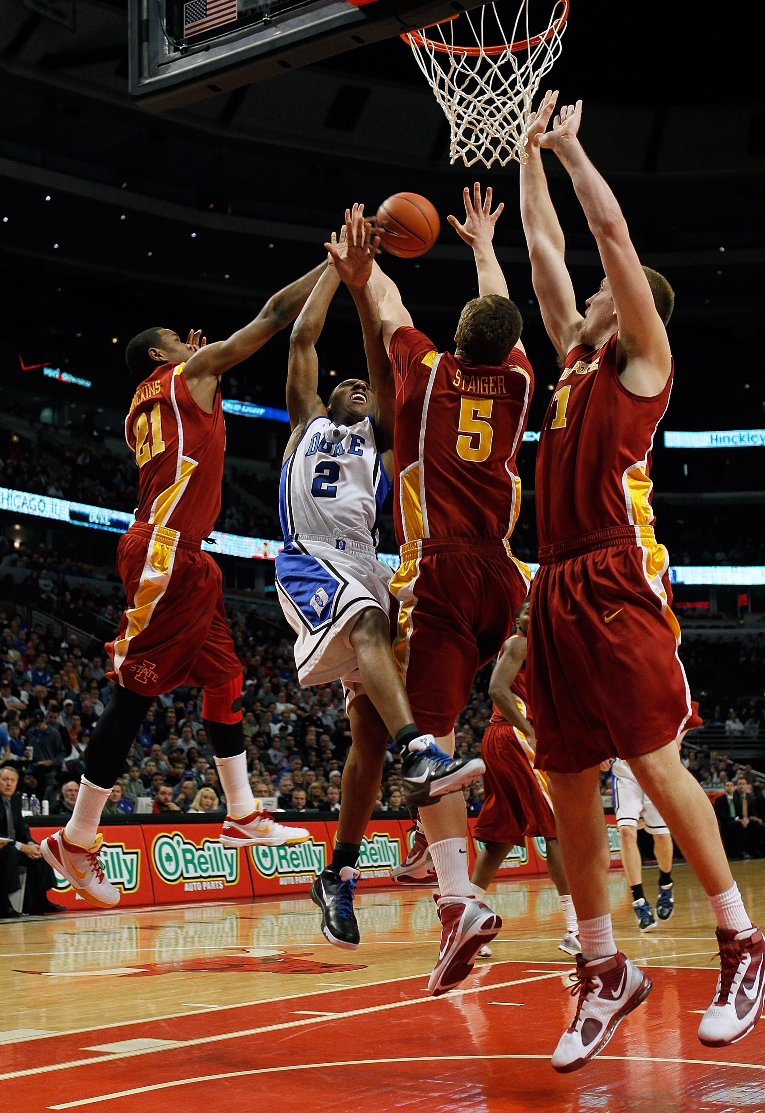 CHICAGO - JANUARY 06: Craig Brackins #21 of the Iowa State Cyclones blocks a shot by Nolan Smith #2 of the Duke Blue Devils as Lucca Staiger #5 and Justin Hamilton #41 of the Cyclones defend at the United Center on January 6, 2010 in Chicago, Illinois. (P CHICAGO - JANUARY 06: Craig Brackins #21 of the Iowa State Cyclones blocks a shot by Nolan Smith #2 of the Duke Blue Devils as Lucca Staiger #5 and Justin Hamilton #41 of the Cyclones defend at the United Center on January 6, 2010 in Chicago, Illinois. (P