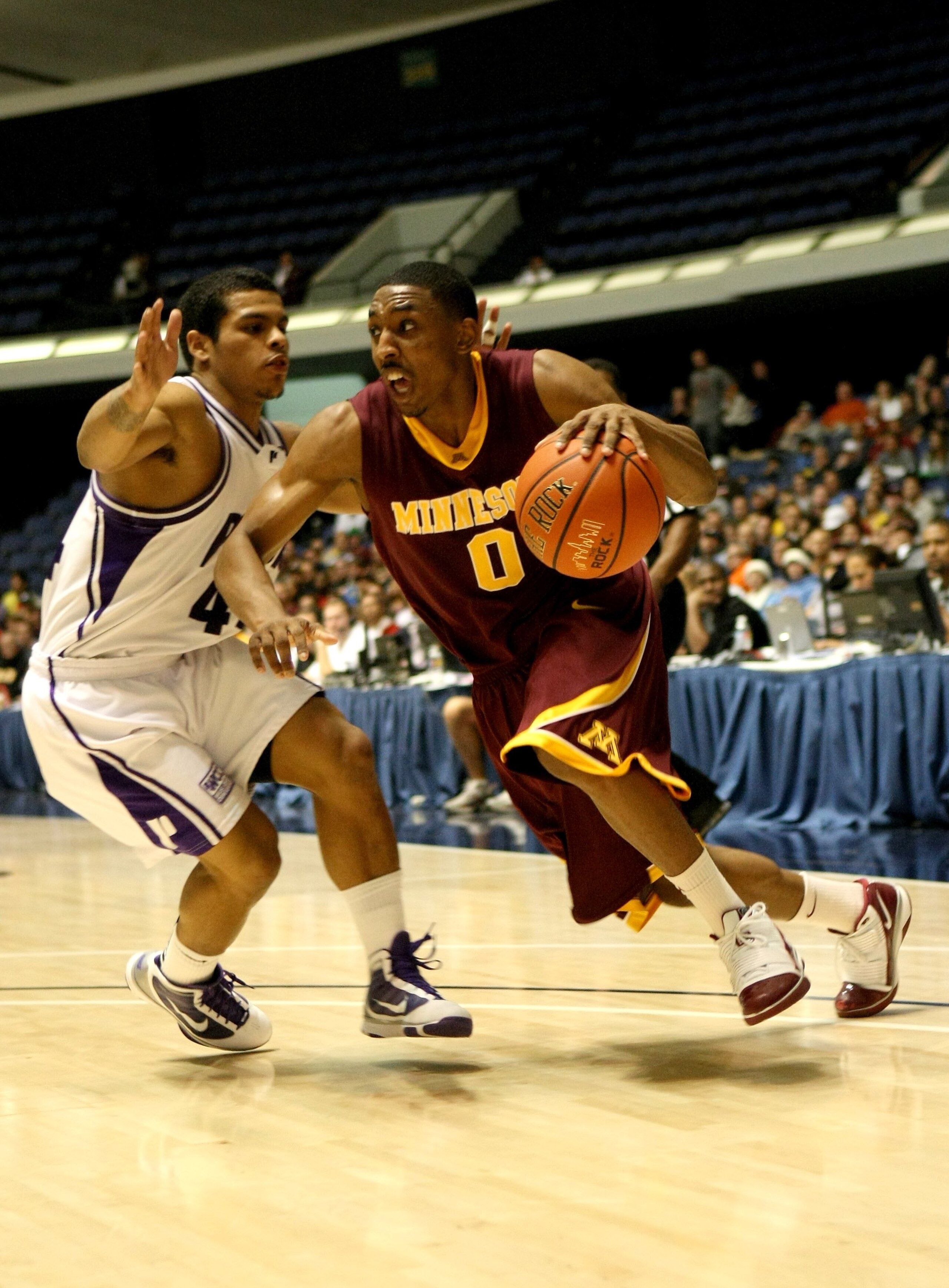 ANAHEIM, CA - NOVEMBER 27:  Al Nolen #0 of the Minnesota Gophers drives against T.J. Campbell  #44 of the Portland Pilots at the 76 Classic at Anaheim Convention Center on November 27, 2009 in Anaheim, California.  (Photo by Stephen Dunn/Getty Images)