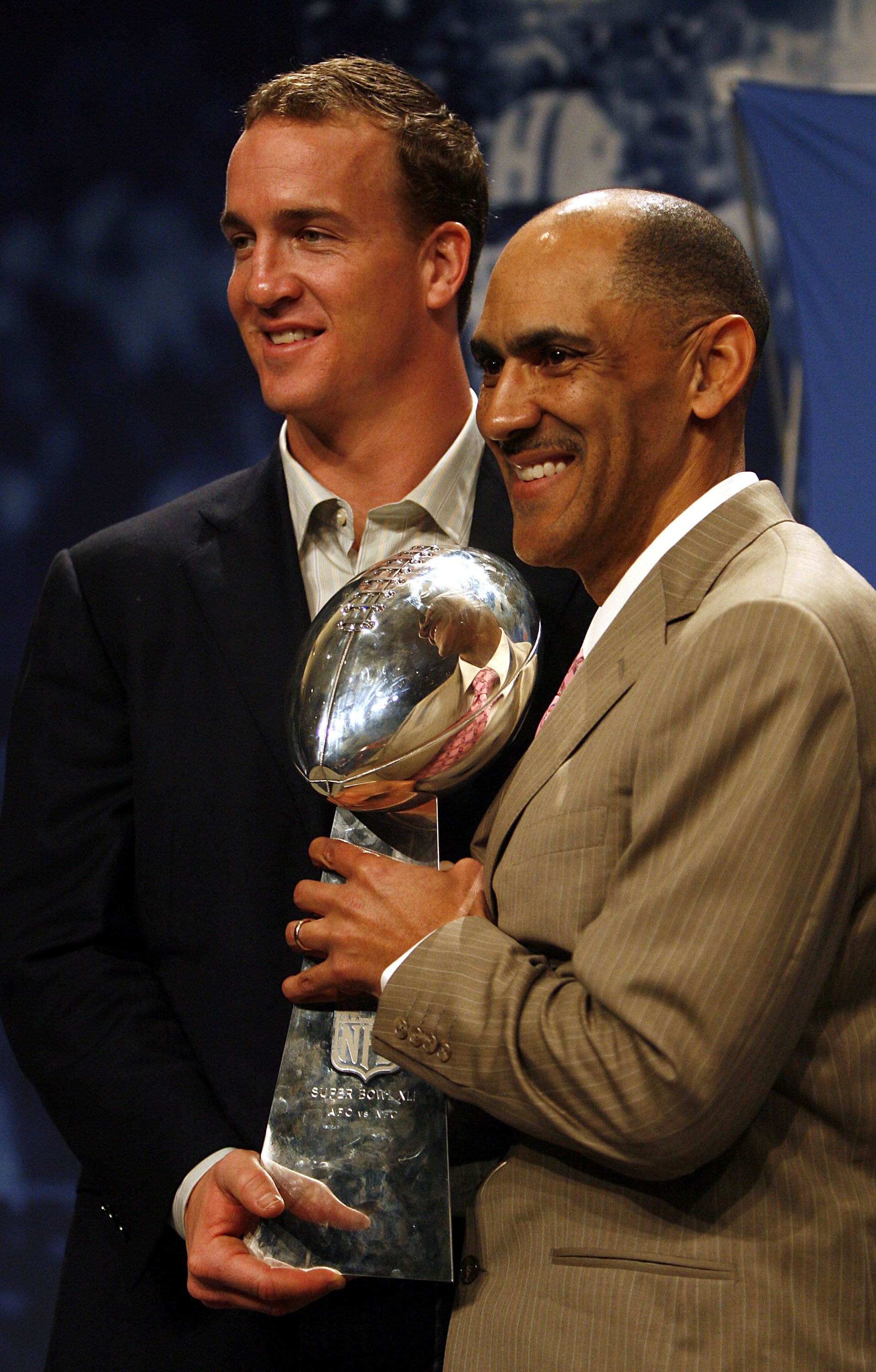 MIAMI BEACH, FL - FEBRUARY 5:  Quarterback Peyton Manning and Head Coach Tony Dungy of the Indianapolis Colts hold the Vince Lombardi Trophy after winning Super Bowl XLI at the Miami Beach Convention Center on February 5, 2007 in Miami Beach, Florida.  (P