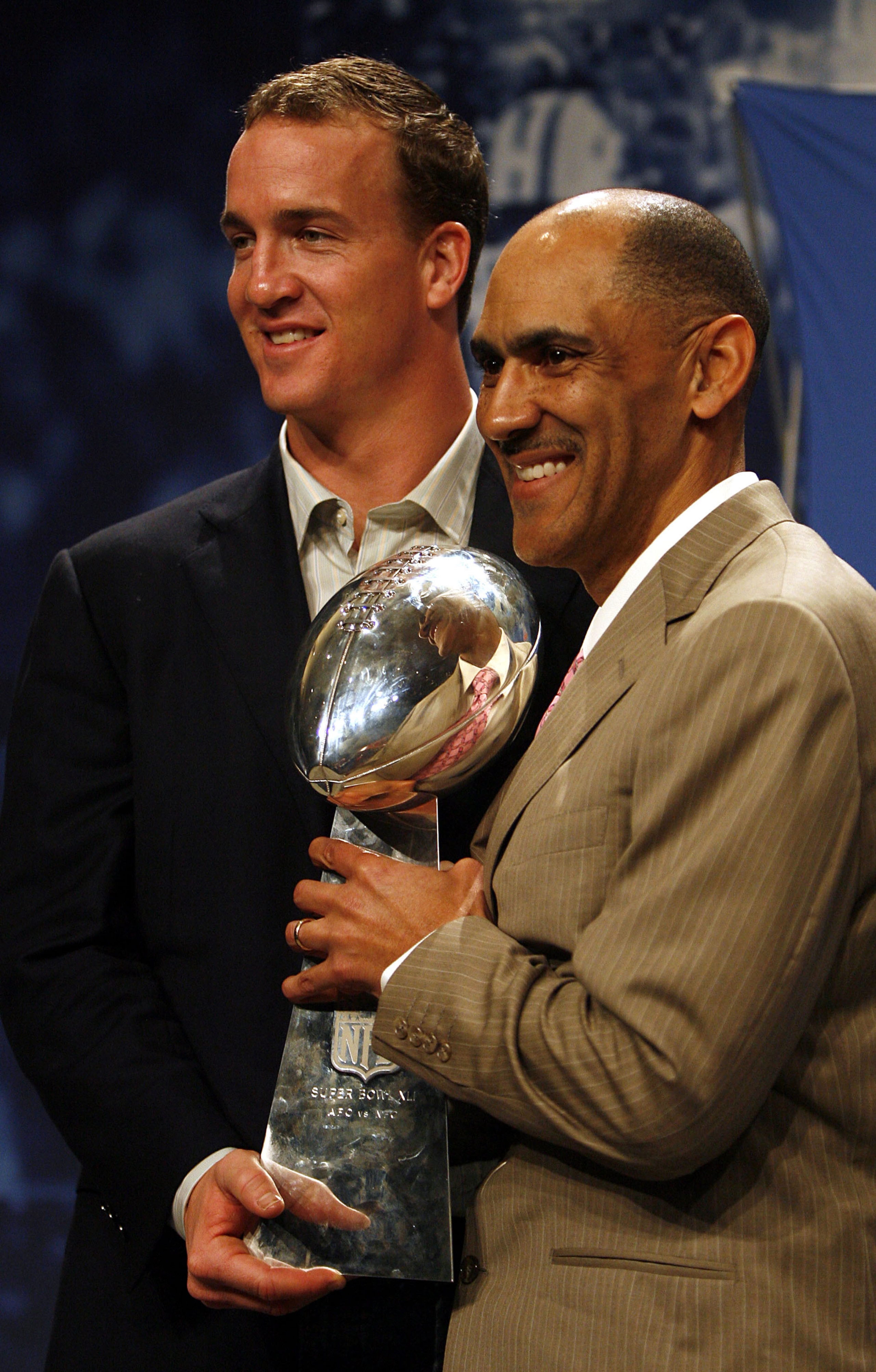 MIAMI BEACH, FL - FEBRUARY 5:  Quarterback Peyton Manning and Head Coach Tony Dungy of the Indianapolis Colts hold the Vince Lombardi Trophy after winning Super Bowl XLI at the Miami Beach Convention Center on February 5, 2007 in Miami Beach, Florida.  (P