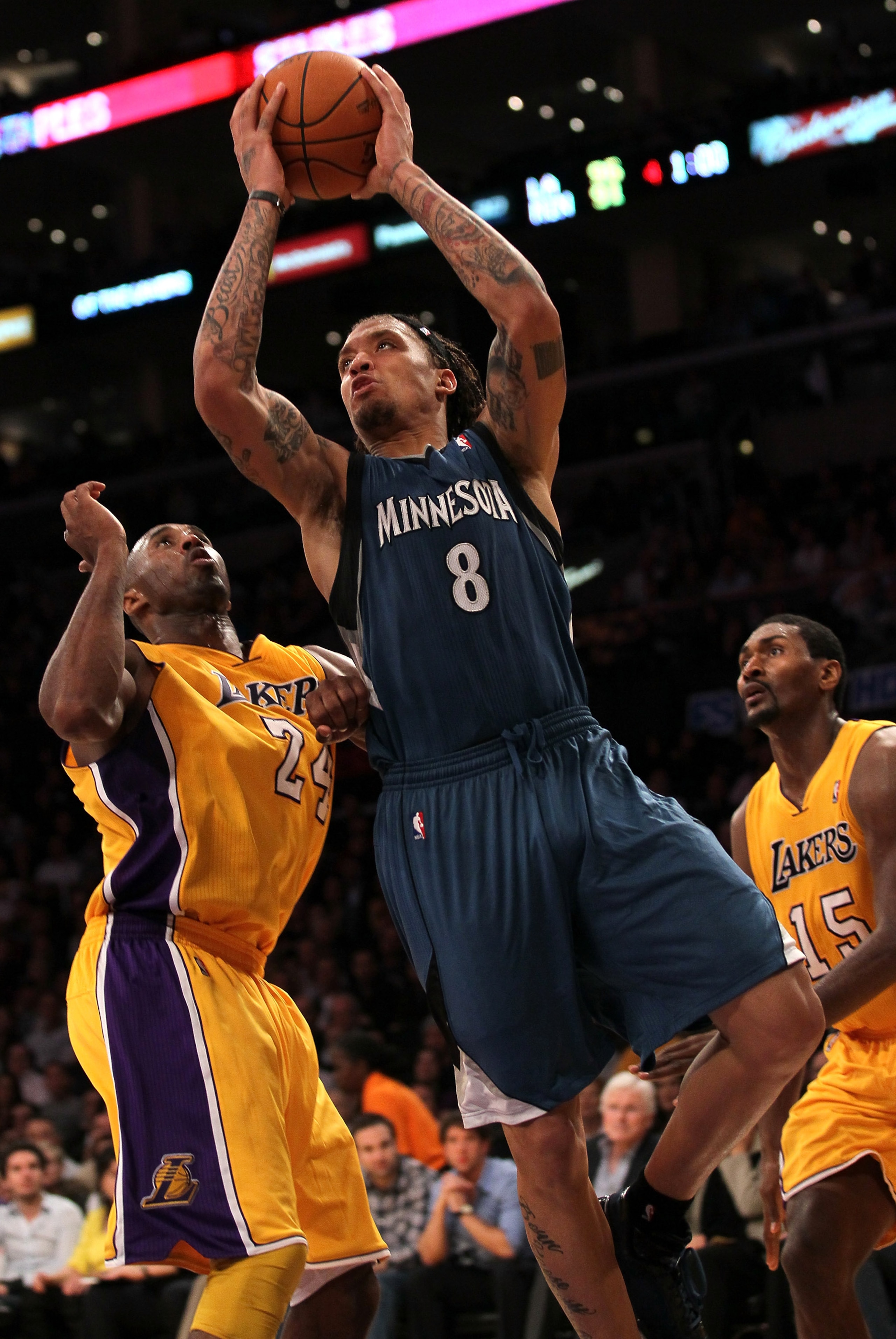 LOS ANGELES, CA - NOVEMBER 09:  Michael Beasley #8 of the Minnesota Timberwolves goes up for a shot over Kobe Bryant #24 of the Los Angeles Lakers at Staples Center on November 9, 2010 in Los Angeles, California. The Lakers won 99-94.   NOTE TO USER: User
