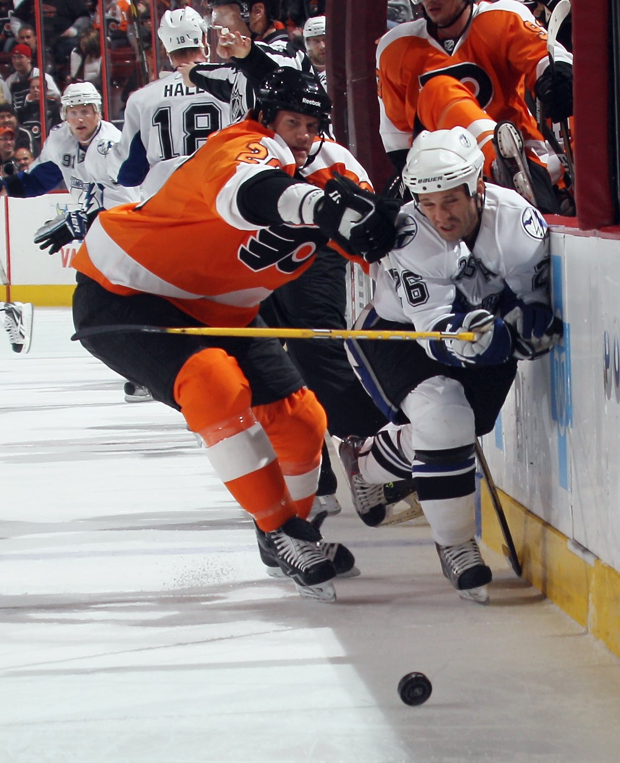 PHILADELPHIA - NOVEMBER 18: Chris Pronger #20 of the Philadelphia Flyers hits Martin St. Louis #26 of the Tampa Bay Lightning at the Wells Fargo Center on November 18, 2010 in Philadelphia, Pennsylvania.  (Photo by Bruce Bennett/Getty Images)