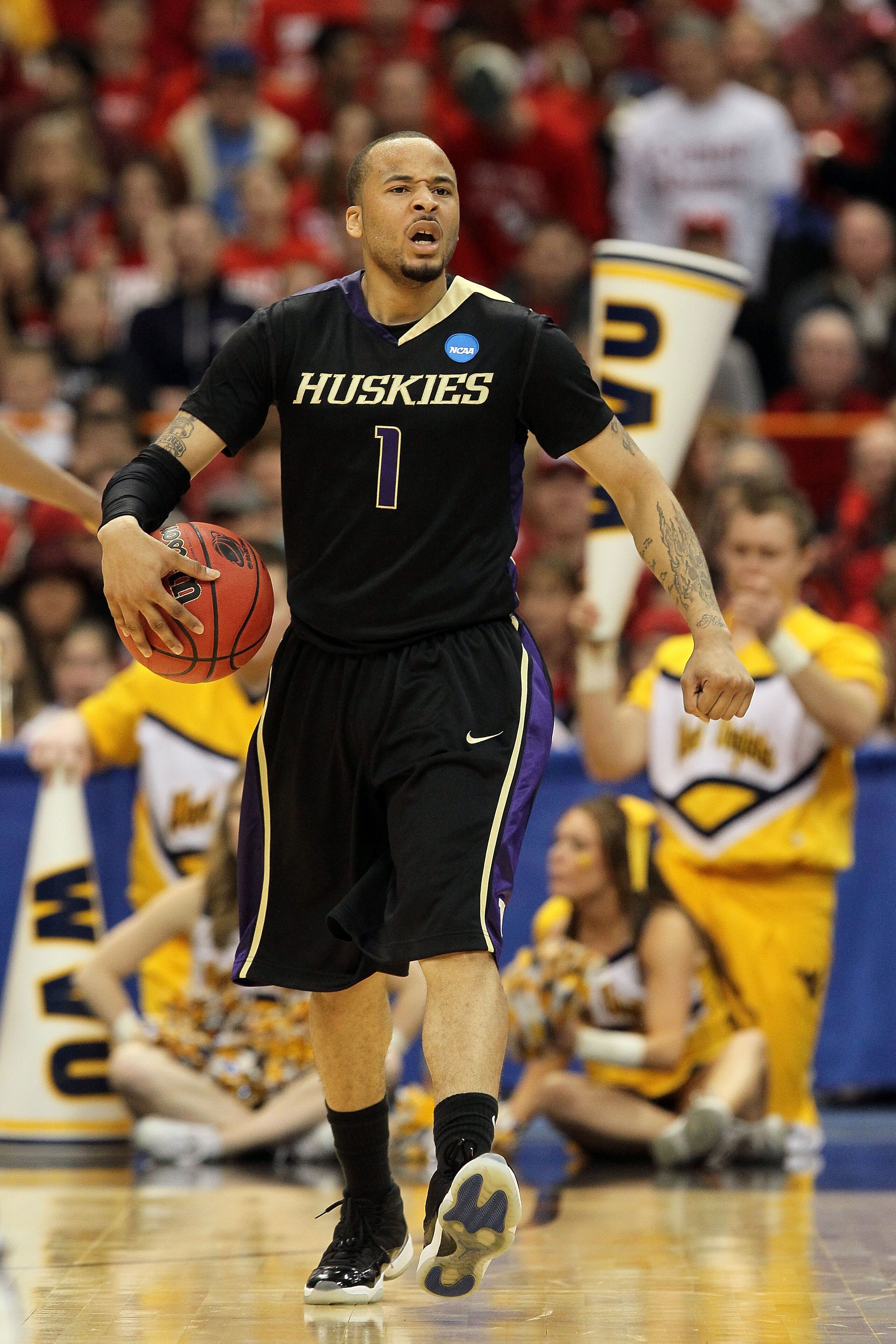 SYRACUSE, NY - MARCH 25:  Venoy Overton #1 of the Washington Huskies reacts against the West Virginia Mountaineers during the east regional semifinal of the 2010 NCAA men's basketball tournament at the Carrier Dome on March 25, 2010 in Syracuse, New York.