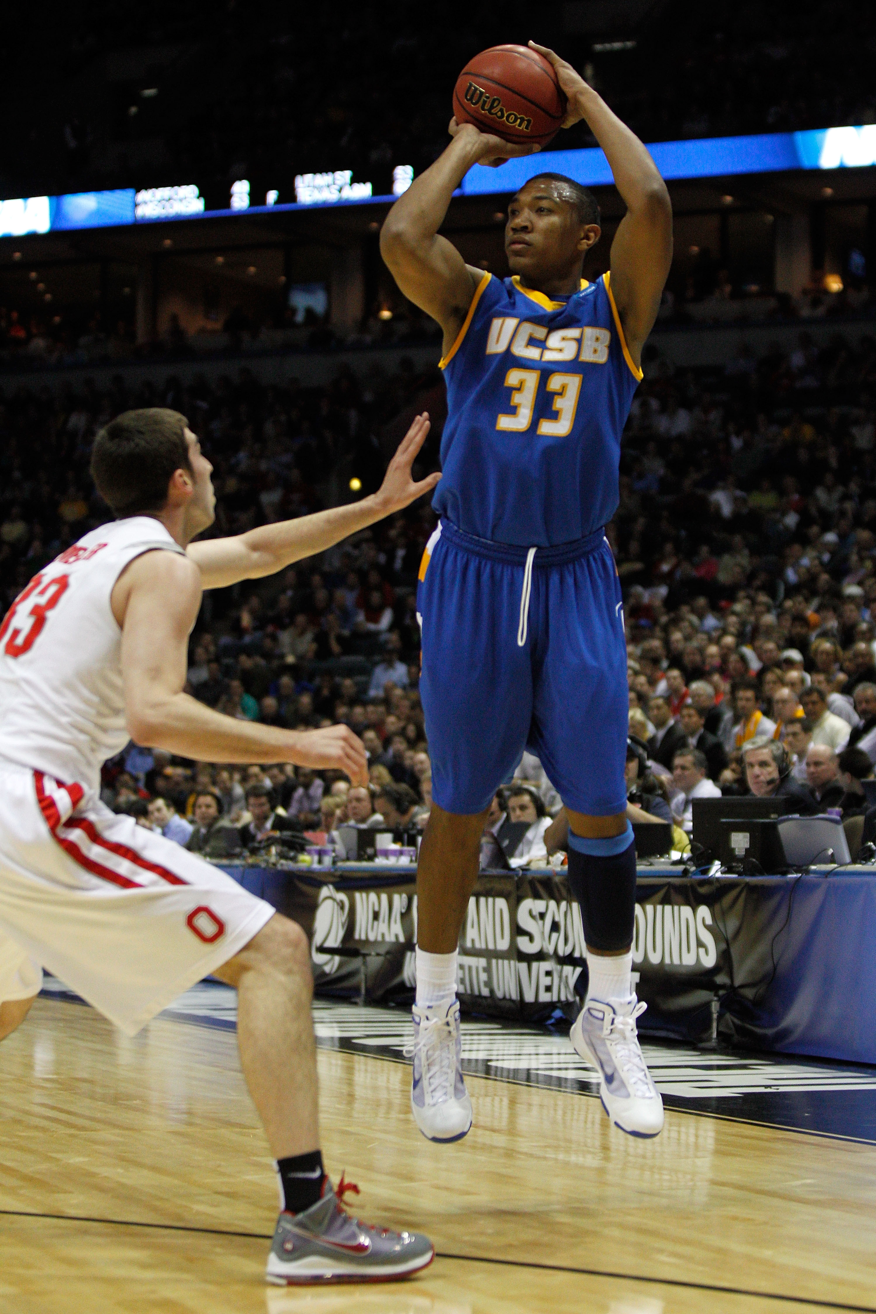 MILWAUKEE - MARCH 19:  Orlando Johnson #33 of the UC Santa Barbara Gauchos shoots a three-pointer in the first half over Jon Diebler #33 of the Ohio State Buckeyes during the first round of the 2010 NCAA men's basketball tournament at the Bradley Center o