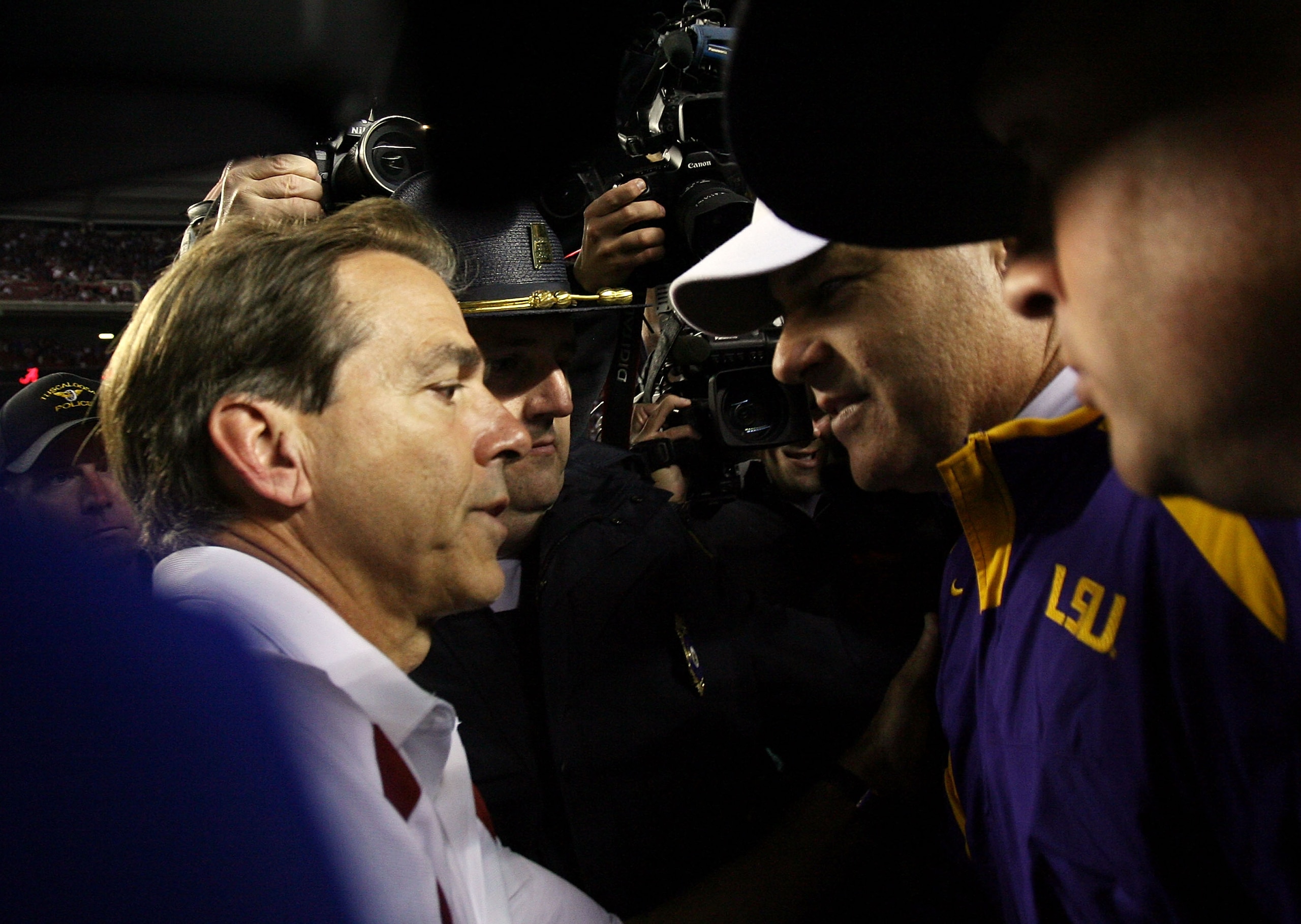 TUSCALOOSA, AL - NOVEMBER 03:  Head coach Les Miles of the LSU Tigers is congratulated by head coach Nick Saban of the Alabama Crimson Tide at Bryant-Denny Stadium on November 3, 2007 in Tuscaloosa, Alabama. LSU defeated Alabama 41-34.  (Photo by Doug Ben