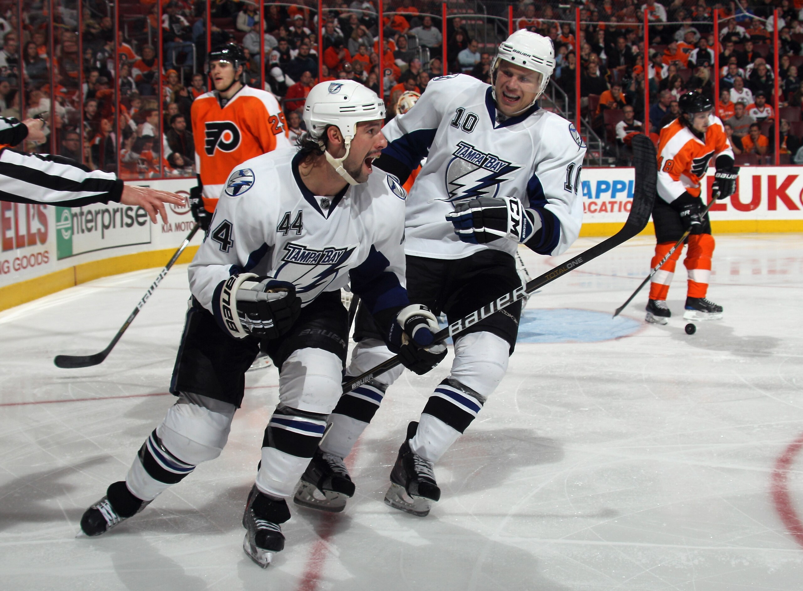 PHILADELPHIA - NOVEMBER 18:  Nate Thompson #44 of the Tampa Bay Lightning scores the game winning goal at 5:19 of the third period against the Philadelphia Flyers and is joined in the celebration Sean Bergenheim #10 at the Wells Fargo Center on November 1