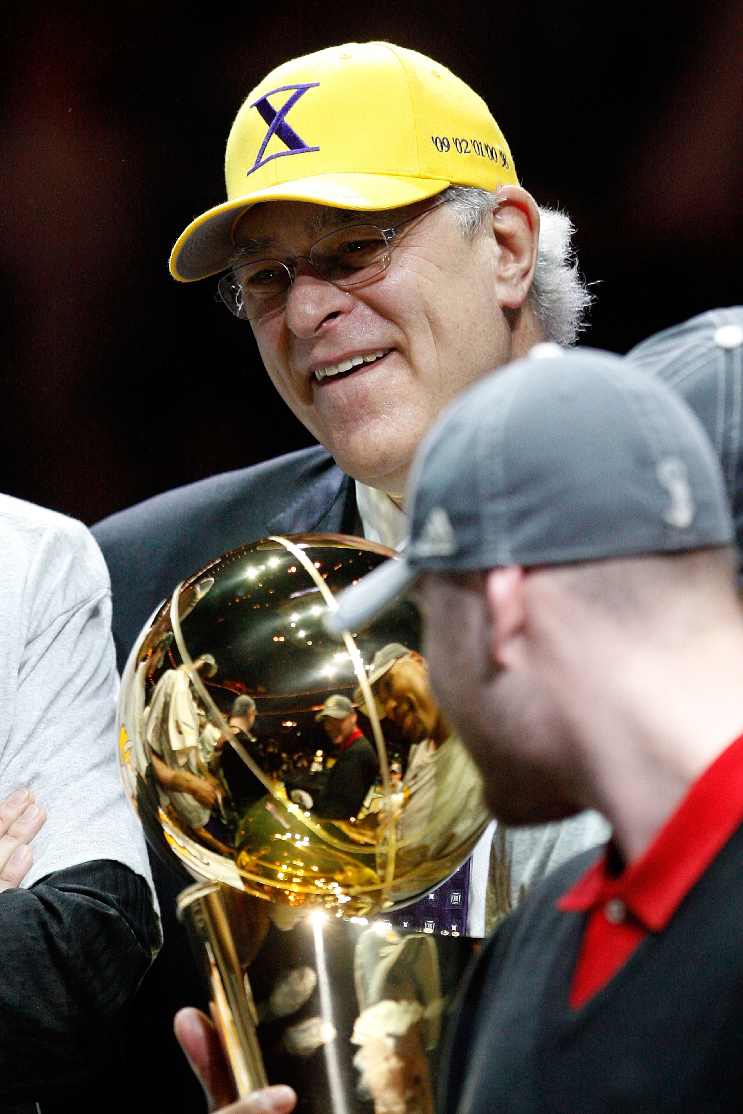 ORLANDO, FL - JUNE 14:  Head coach Phil Jackson of the Los Angeles Lakers holds up the Larry O'Brien trophy after the Lakers defeated the Orlando Magic 99-86 in Game Five of the 2009 NBA Finals on June 14, 2009 at Amway Arena in Orlando, Florida.  NOTE TO