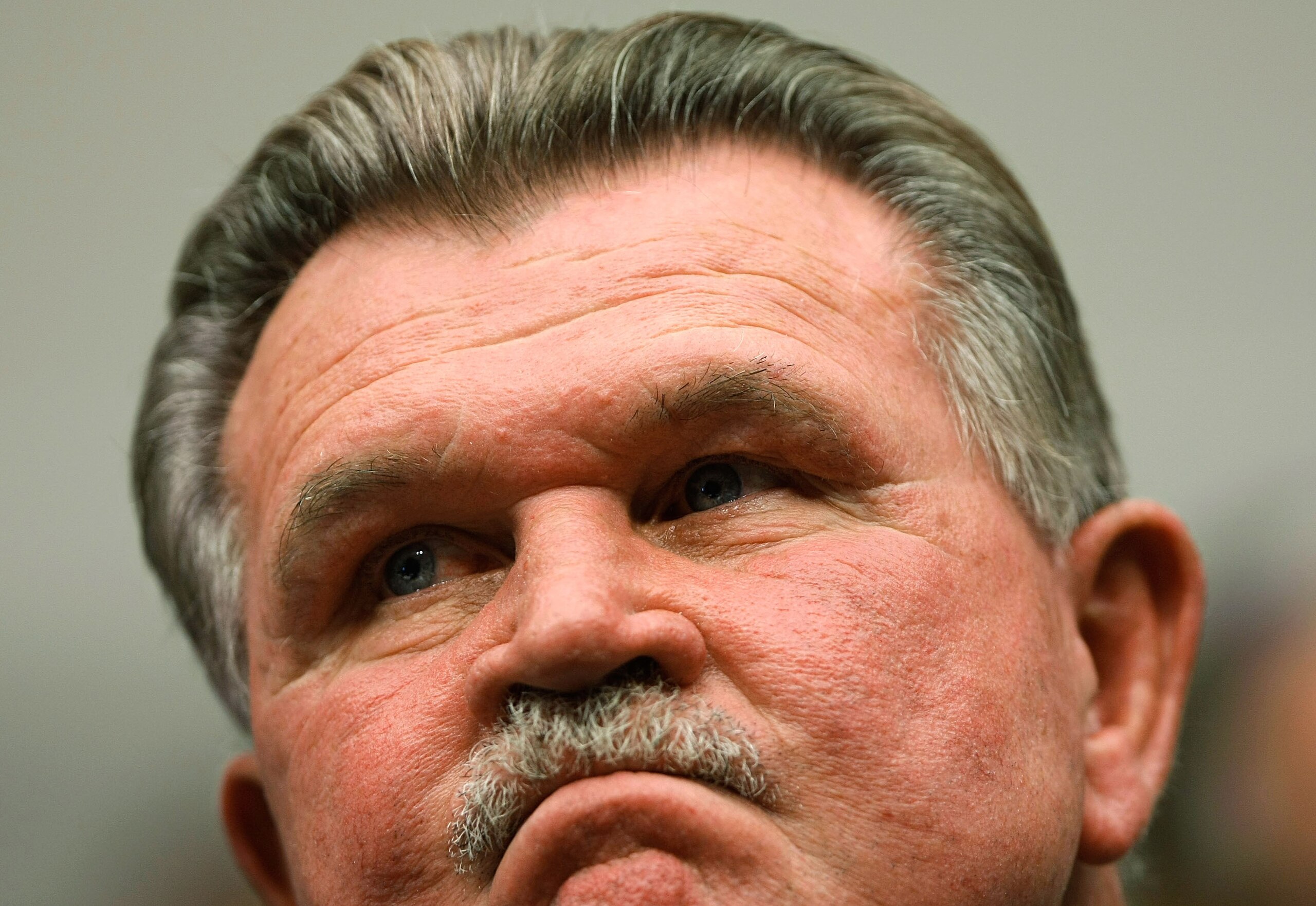 WASHINGTON - JUNE 26:  During a congressional hearing on the National Football League's system for compensating retired players, Hall of Fame tight end and head coach Mike Ditka listens to testimony June 26, 2007 in Washington, DC. Former players and coac