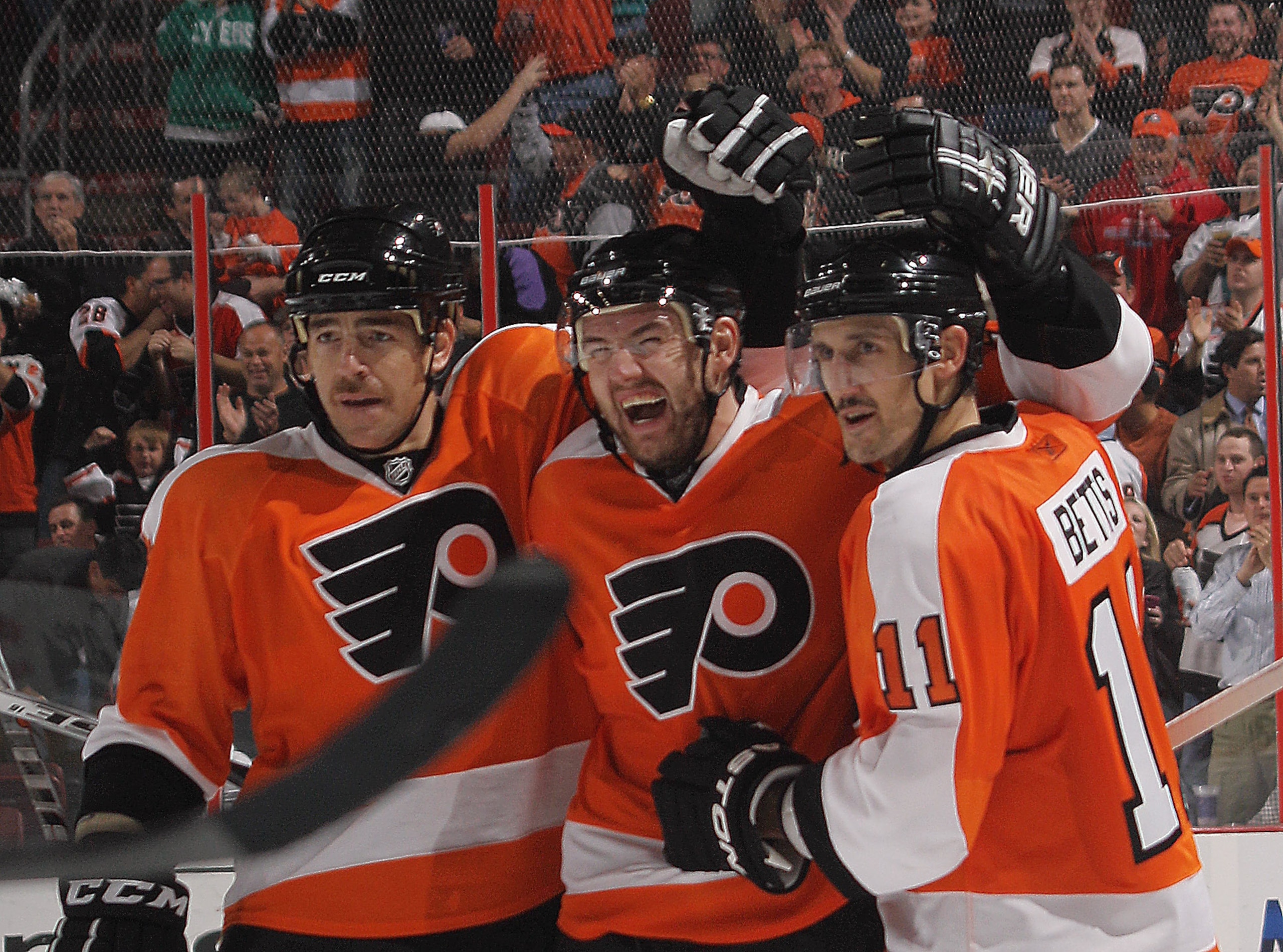 PHILADELPHIA - NOVEMBER 18: (L-R) Sean O'Donnell #6, Andrej Meszaros #41 and Blair Betts #11 of the Philadelphia Flyers celebrate Meszaros' second period goal against the Tampa Bay Lightning at the Wells Fargo Center on November 18, 2010 in Philadelphia,
