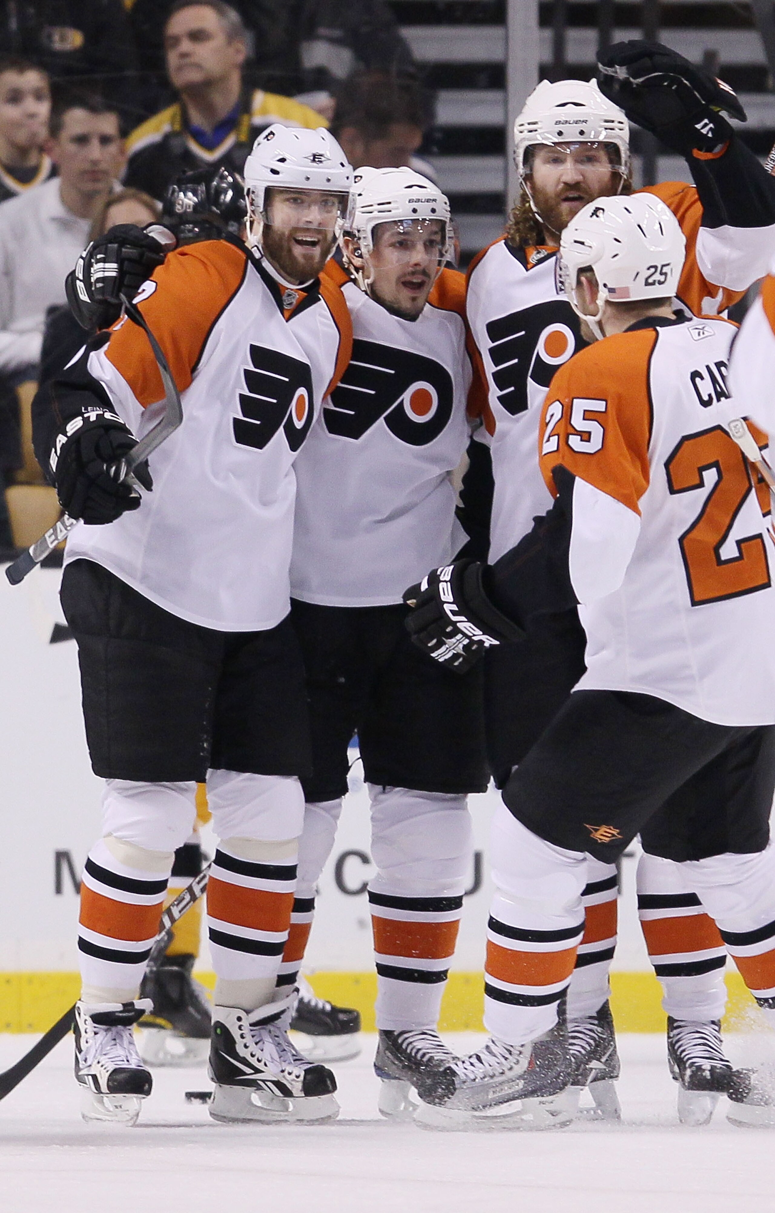 BOSTON - MAY 10:  Scott Hartnell #19 of the Philadelphia Flyers is congratulated by teammates Matt Carle #25, Ville Leino #22 and Danny Briere #48 after Hartnell scored a goal in the first period against the Boston Bruins in Game Five of the Eastern Confe