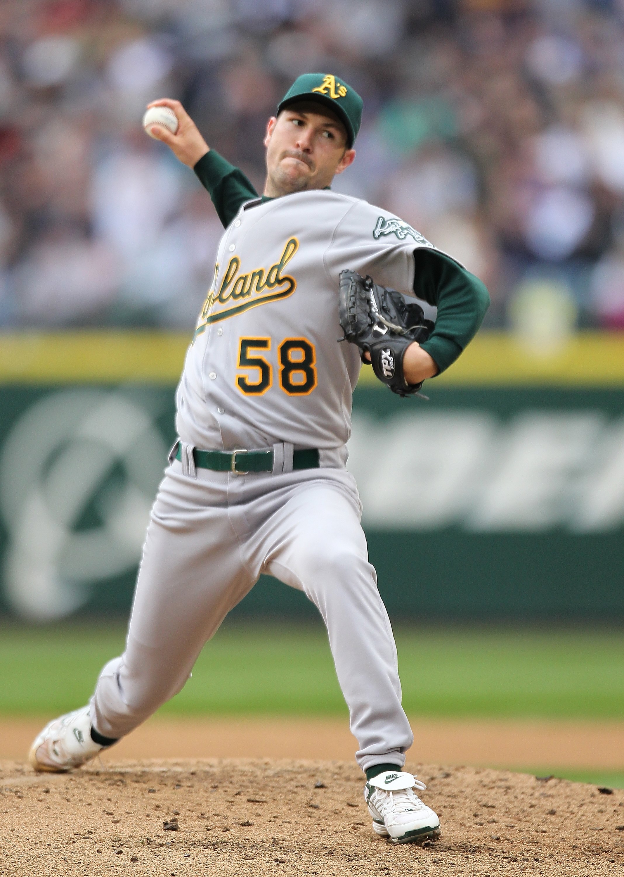 SEATTLE - APRIL 12:  Starting pitcher Justin Duchscherer #58 of the the Oakland Athletics pitches against the Seattle Mariners during the Mariners' home opener at Safeco Field on April 12, 2010 in Seattle, Washington. (Photo by Otto Greule Jr/Getty Images