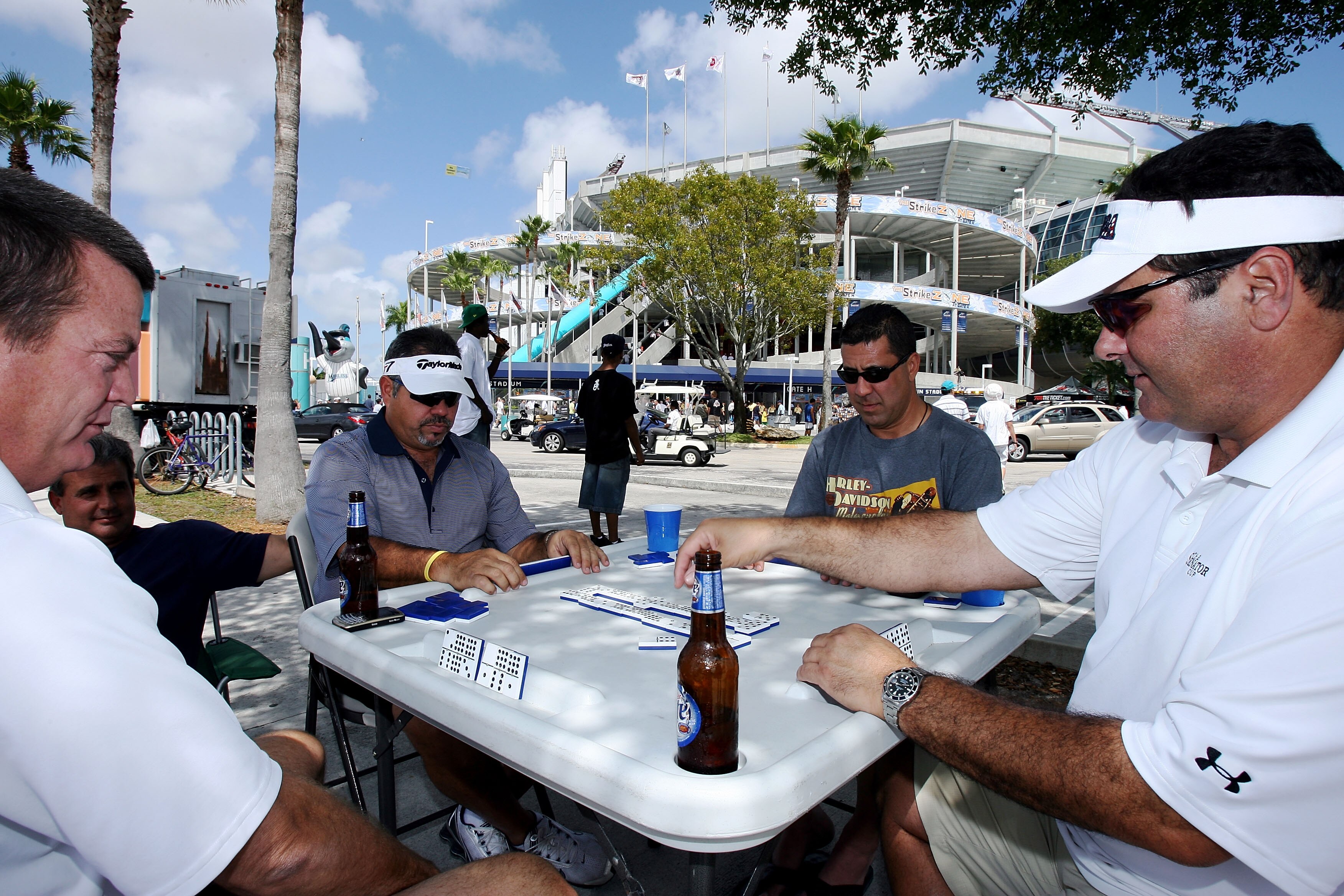 MIAMI - MARCH 31:  Some fans wait for the gate to open by playing dominos prior to the Florida Marlins game against the New York Mets on Opening Day at Dolphin Stadium on March 31, 2008 in Miami, Florida.  (Photo by Doug Benc/Getty Images)